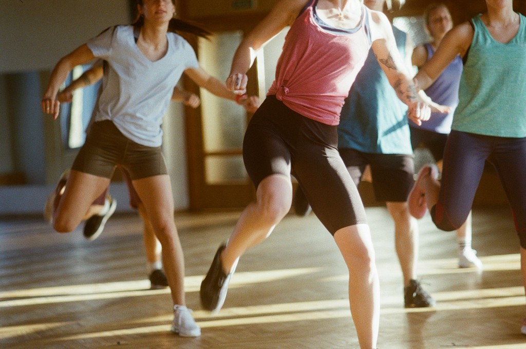 group-of-women-running-on-brown-wooden-floor - kaspars-eglitis (unsplash)./pho