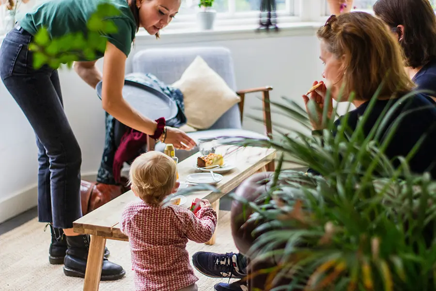Family spending time indoors in a bright, well ventilated home with clean indoor air and improved comfort.