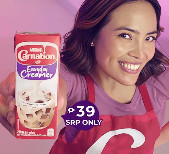 Asian woman with apron smiling and holding package