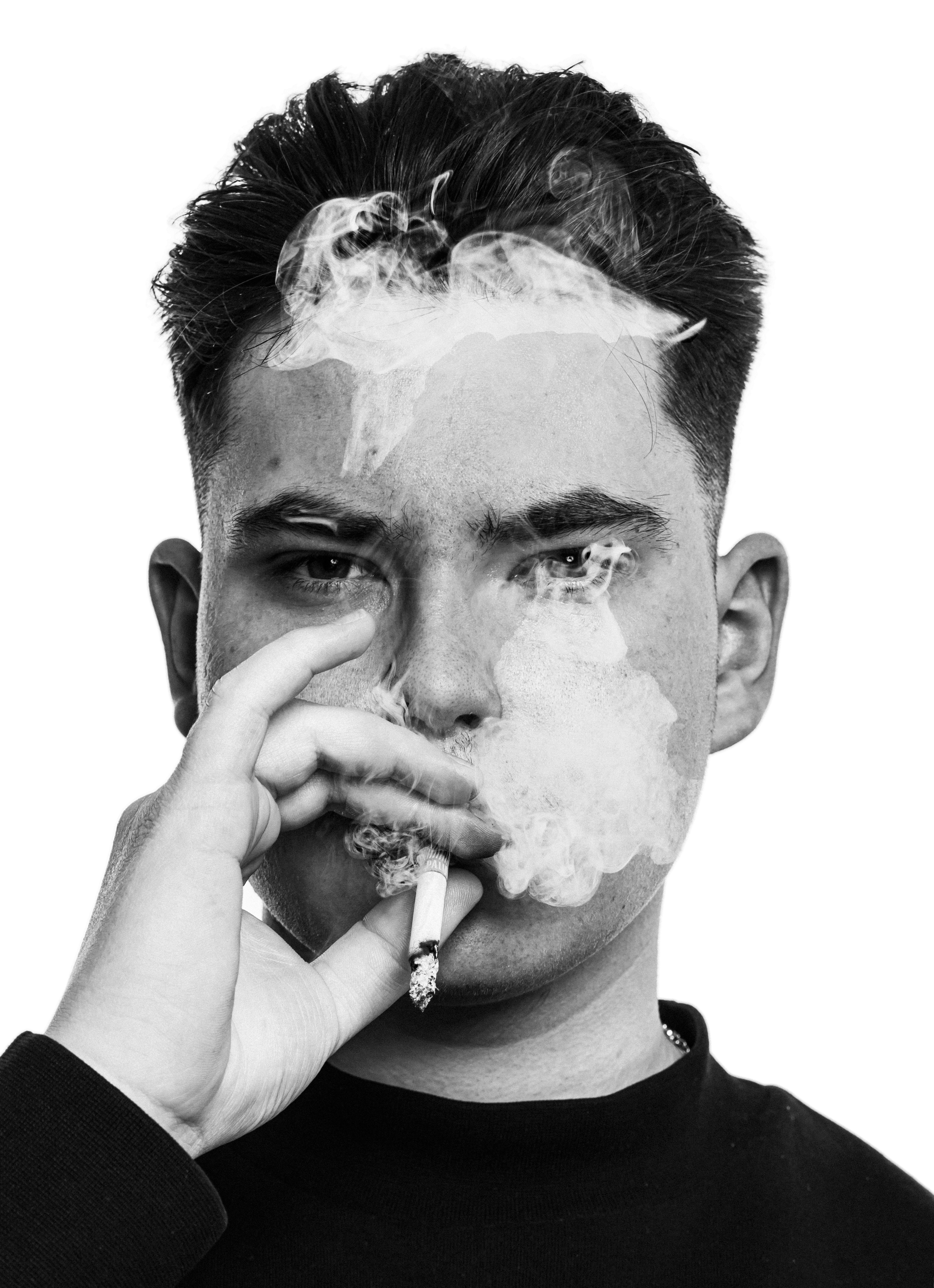 two men riding motocross bikes on brown sand