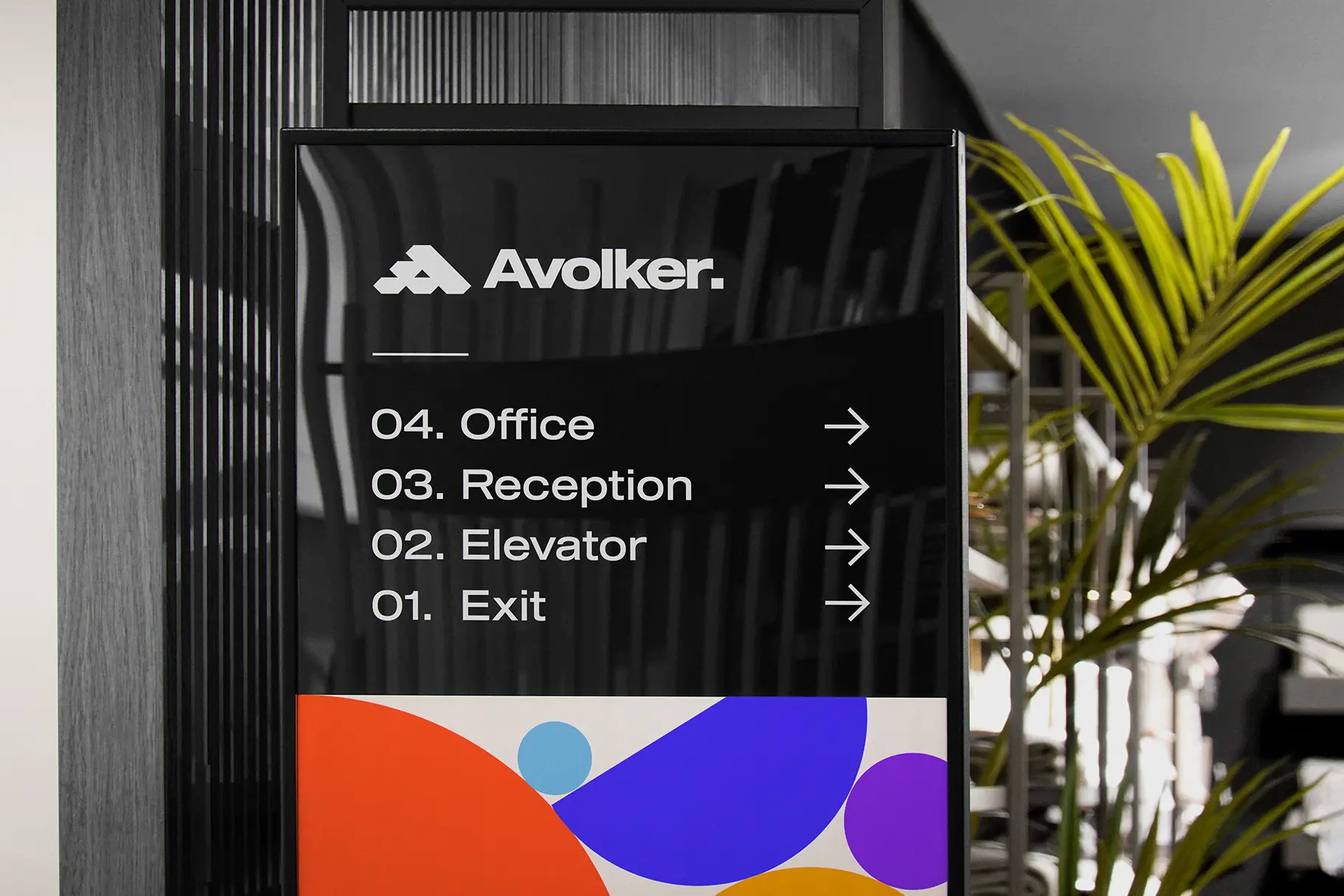 Wayfinding signage mockup in a modern office environment with realistic branding and directional design.
