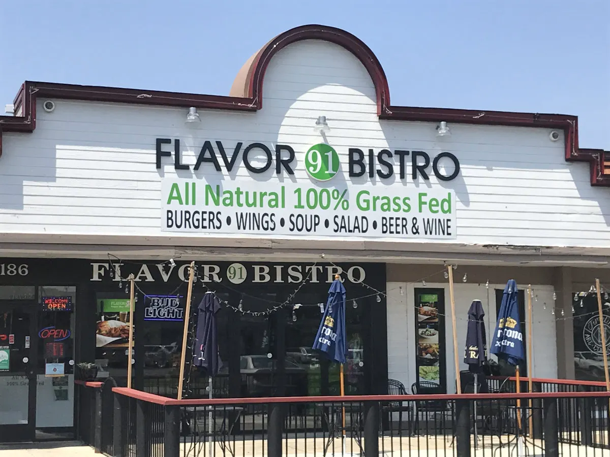 Flavor 91 Bistro storefront with green sign on E Main St
