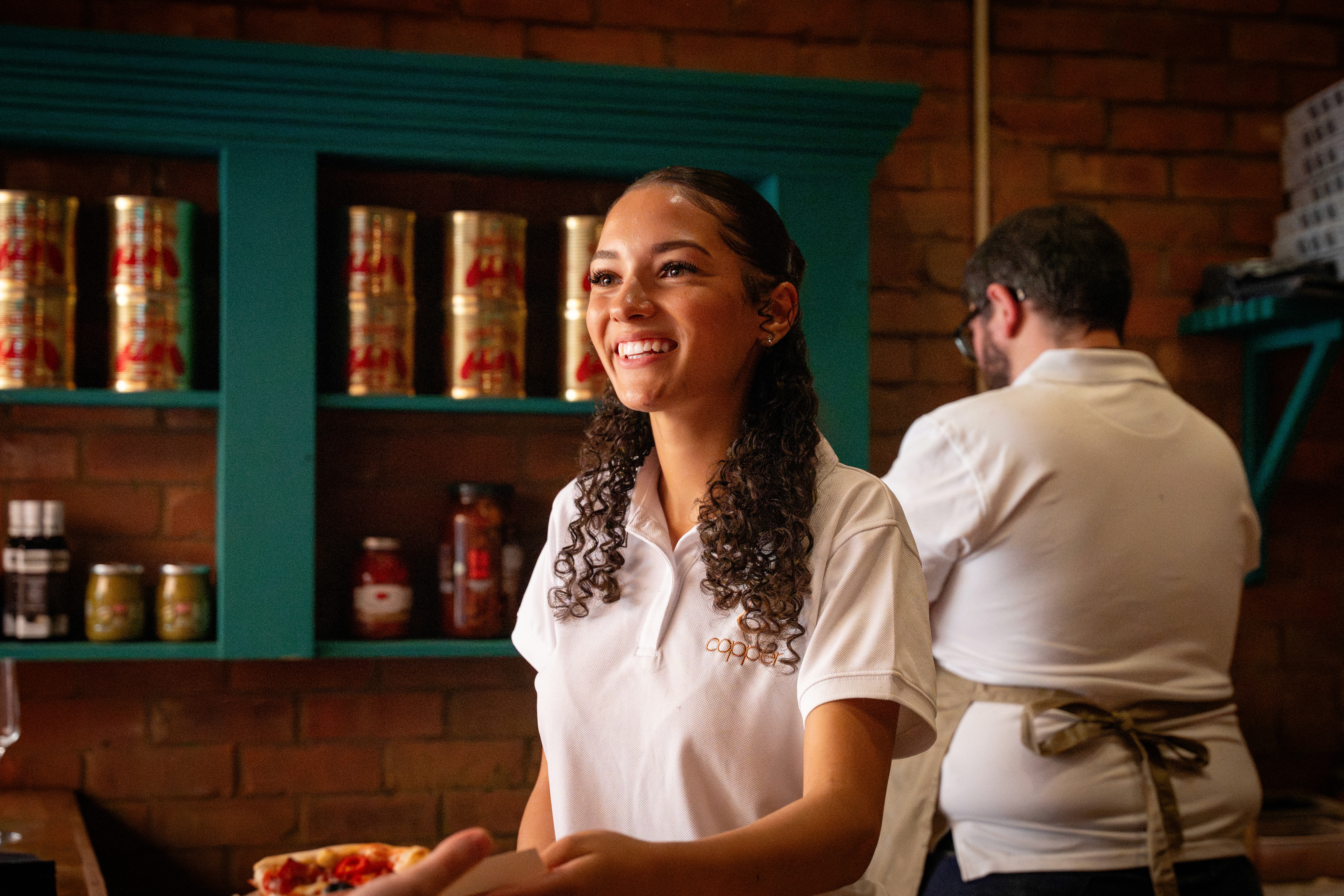 Professional Copper Events staff delivering attentive luxury catering service