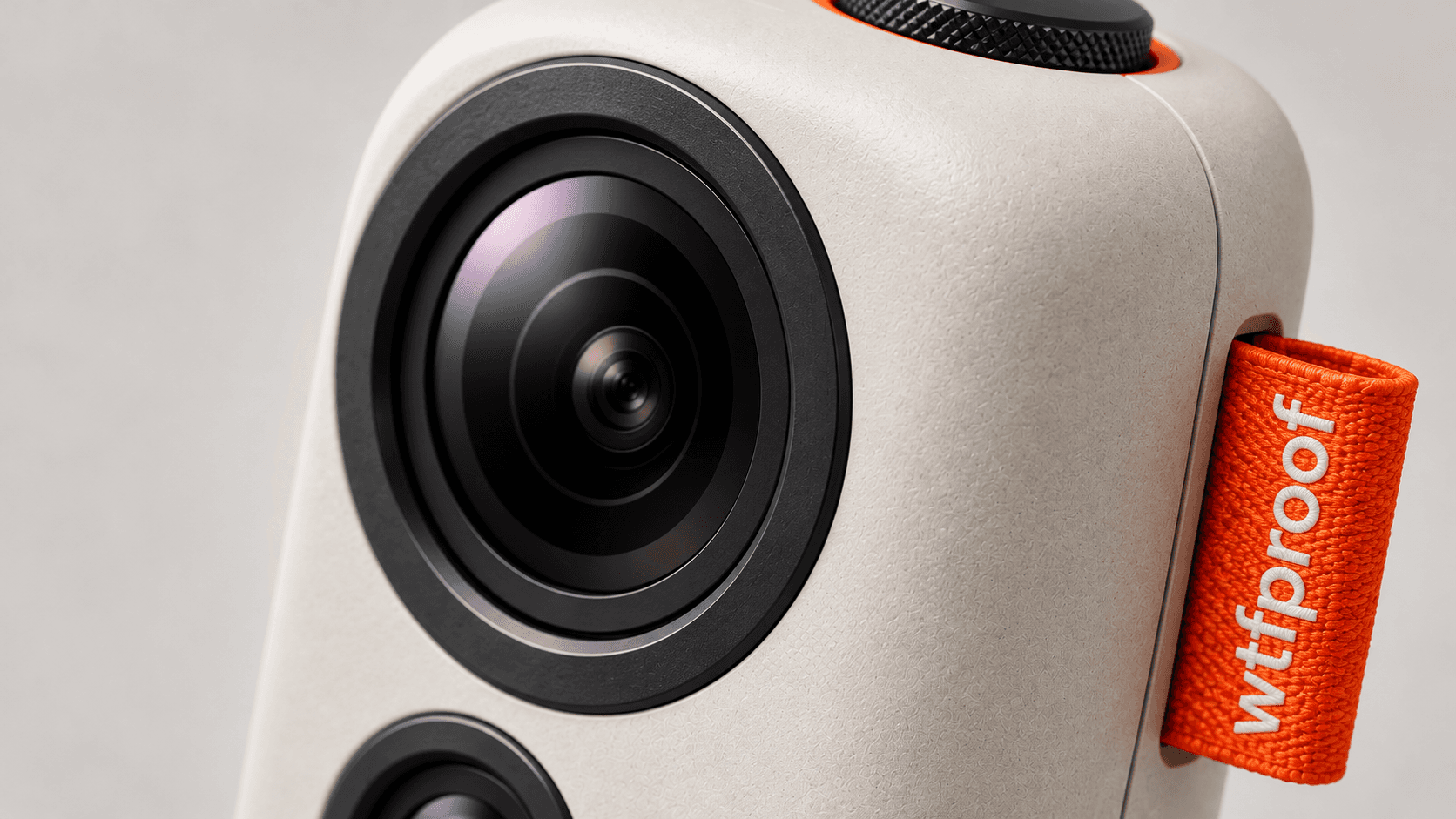 ØYE action camera seen from the front, its large wide-angle lens filling the frame