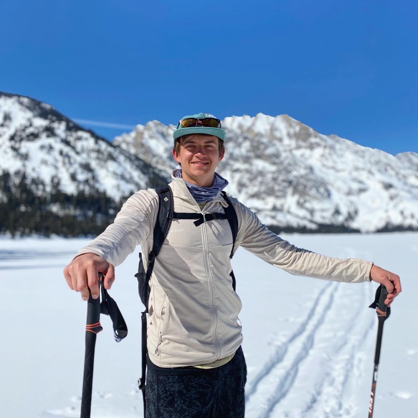 man filming on beach