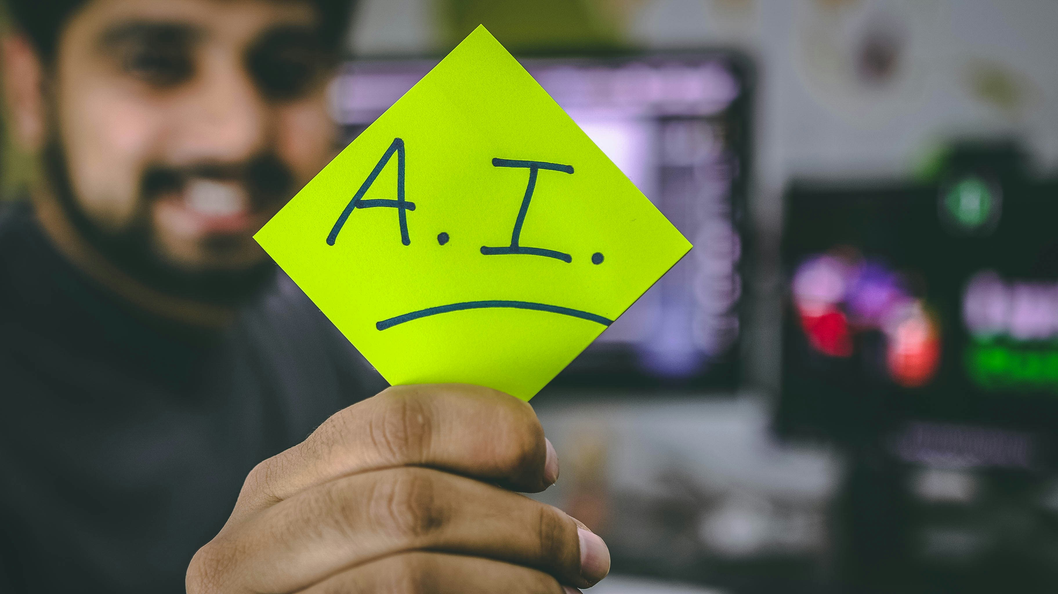 man holding ai sticker - How Does AI Increase Productivity