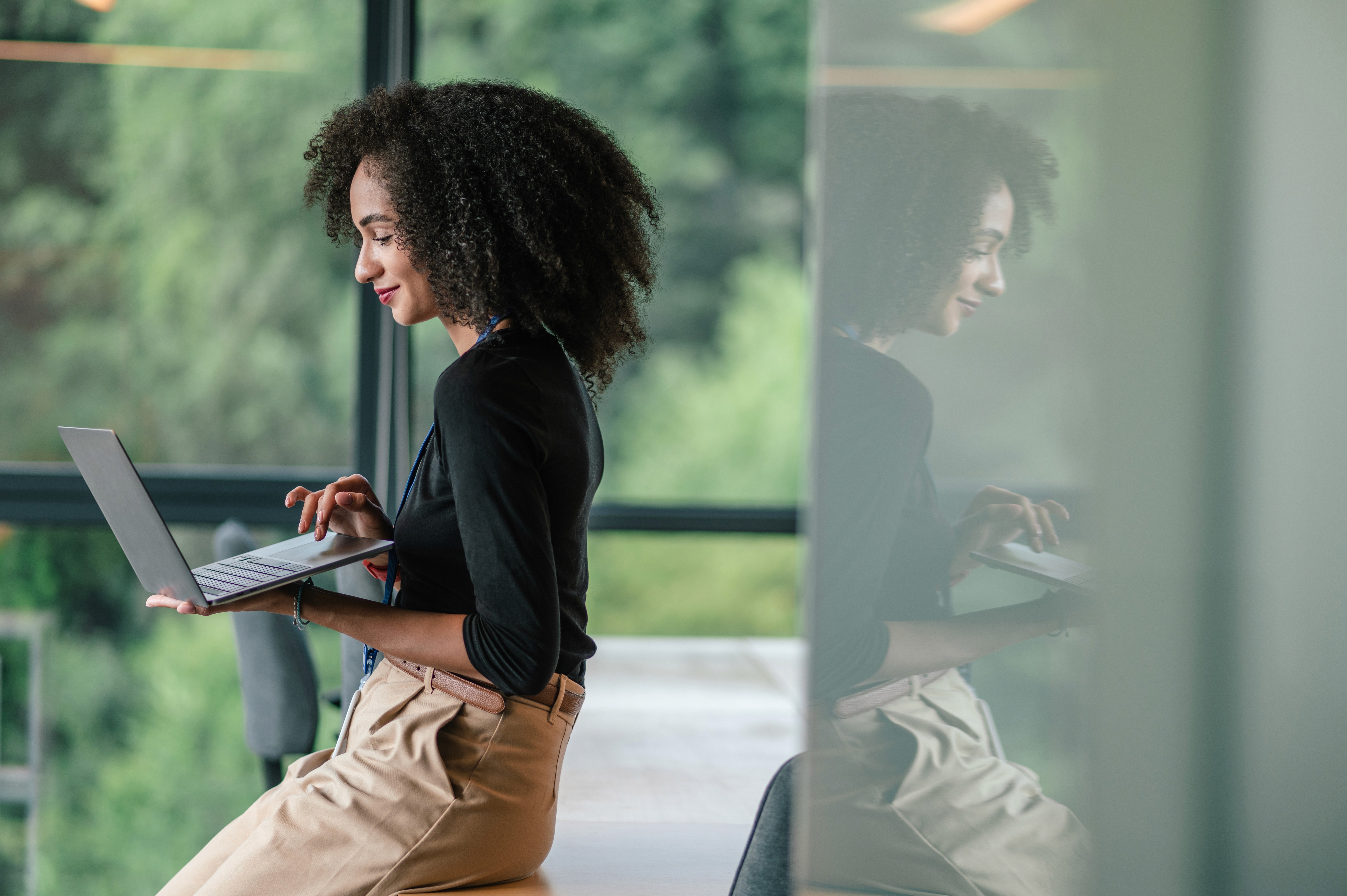 A photograph of a developer using signageOS' DevSpace to deploy one HTML5 app across all signage hardware with unified APIs