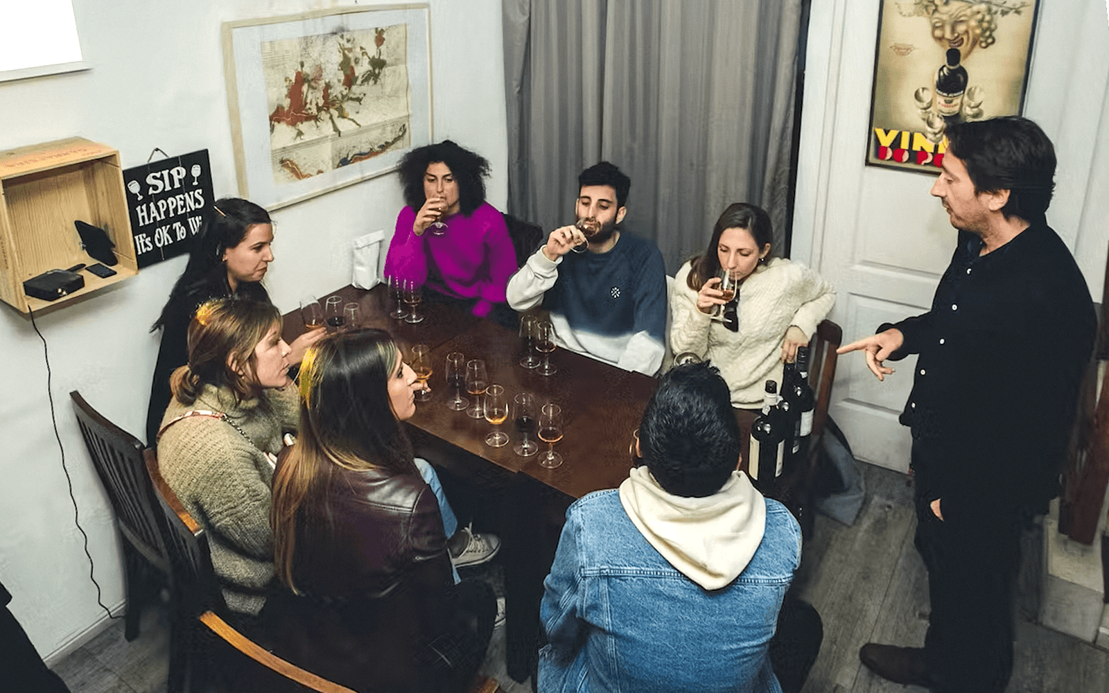 Group enjoying wine tasting during The Original Porto Petiscos Crawl.
