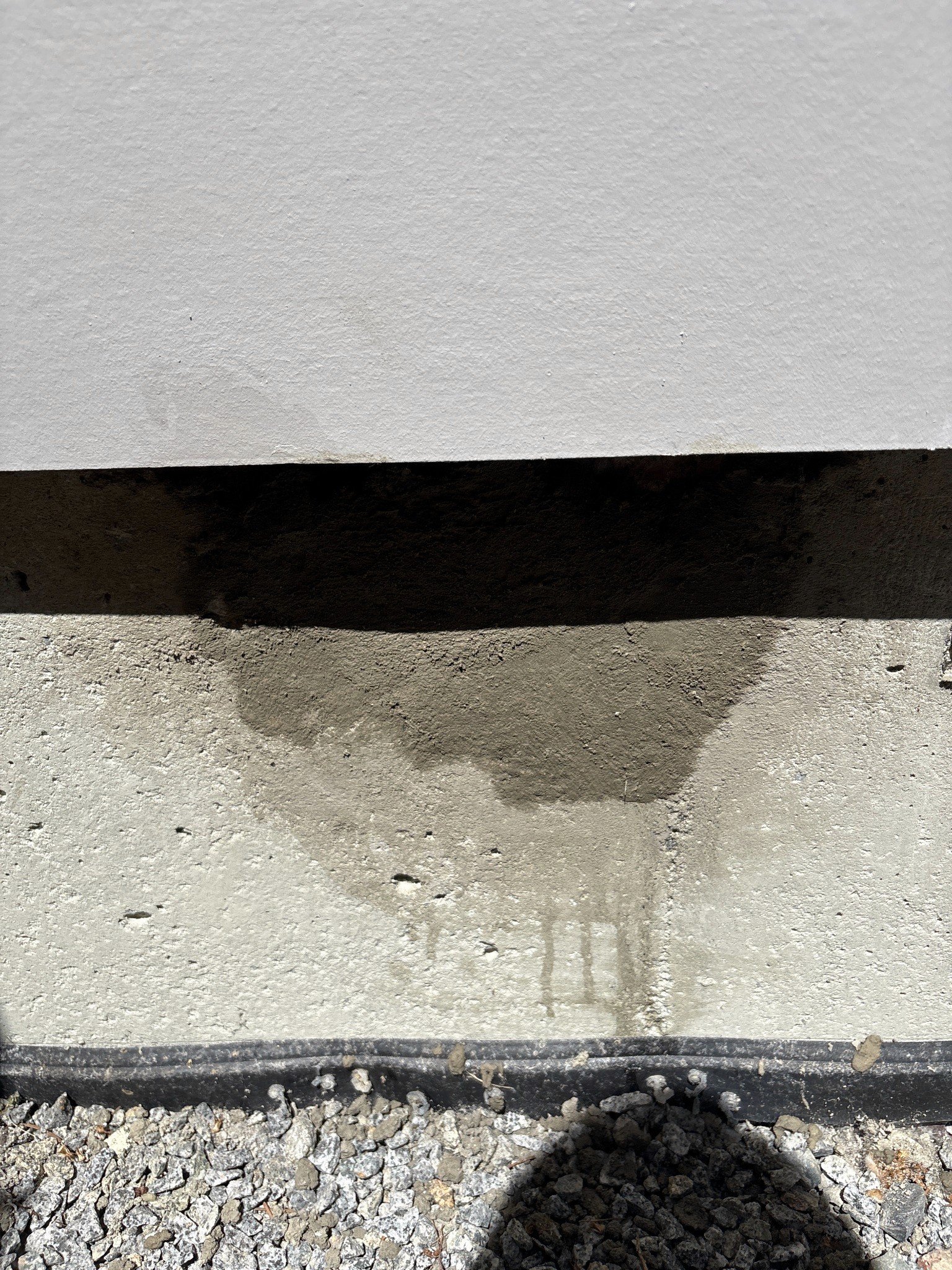 Exterior concrete surface after preparation and localized patch repair.