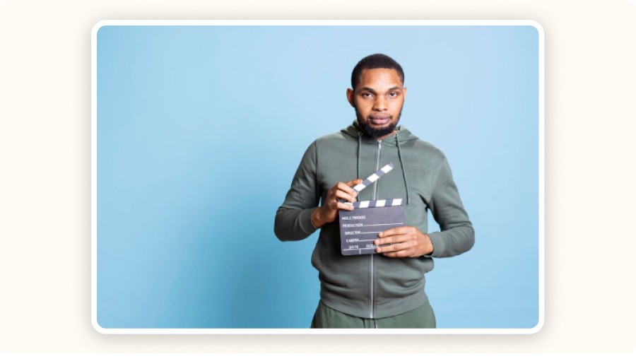 Man holding a clapperboard