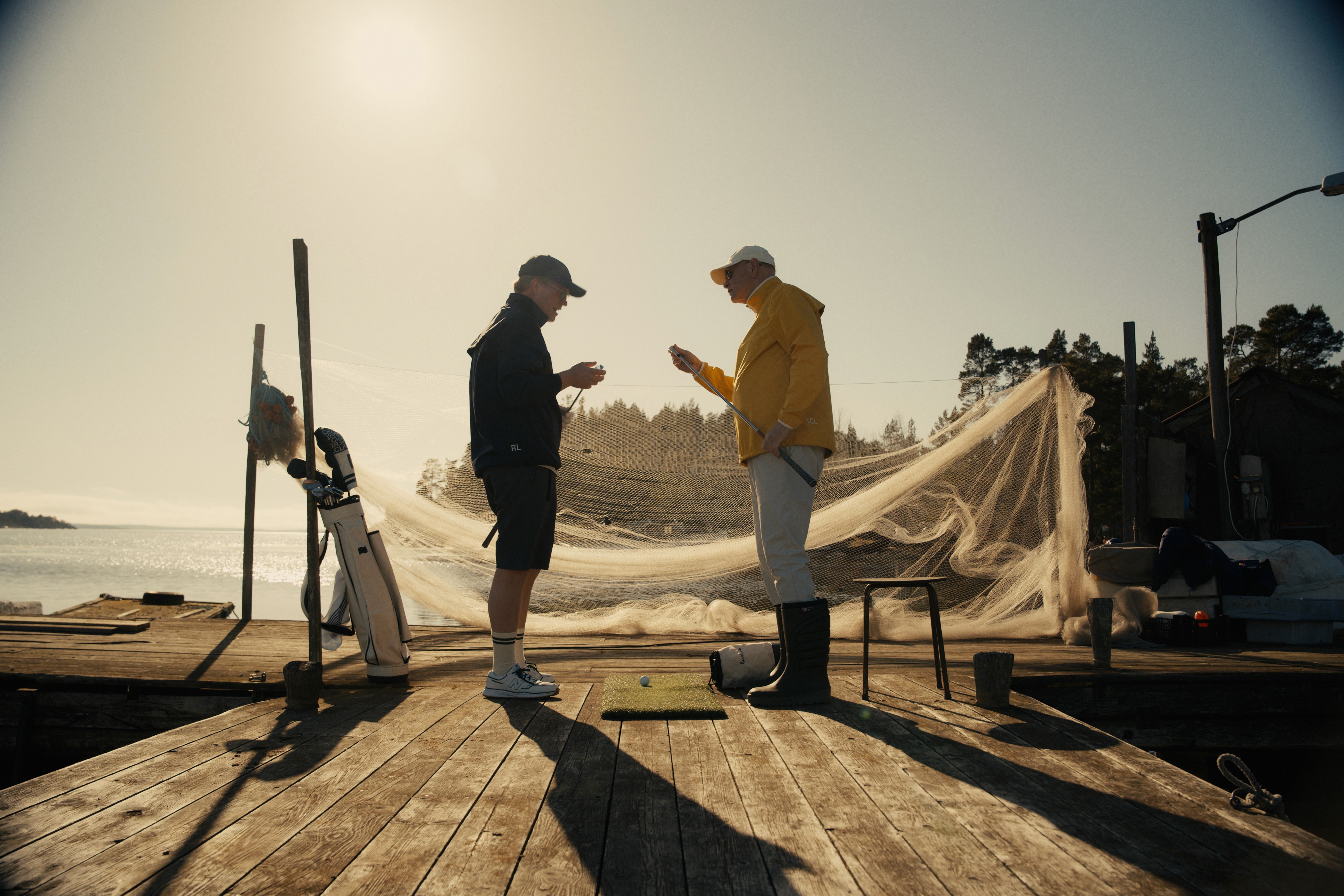 Streetside billboard with flyposters of the Batch.Works brand and illustrations