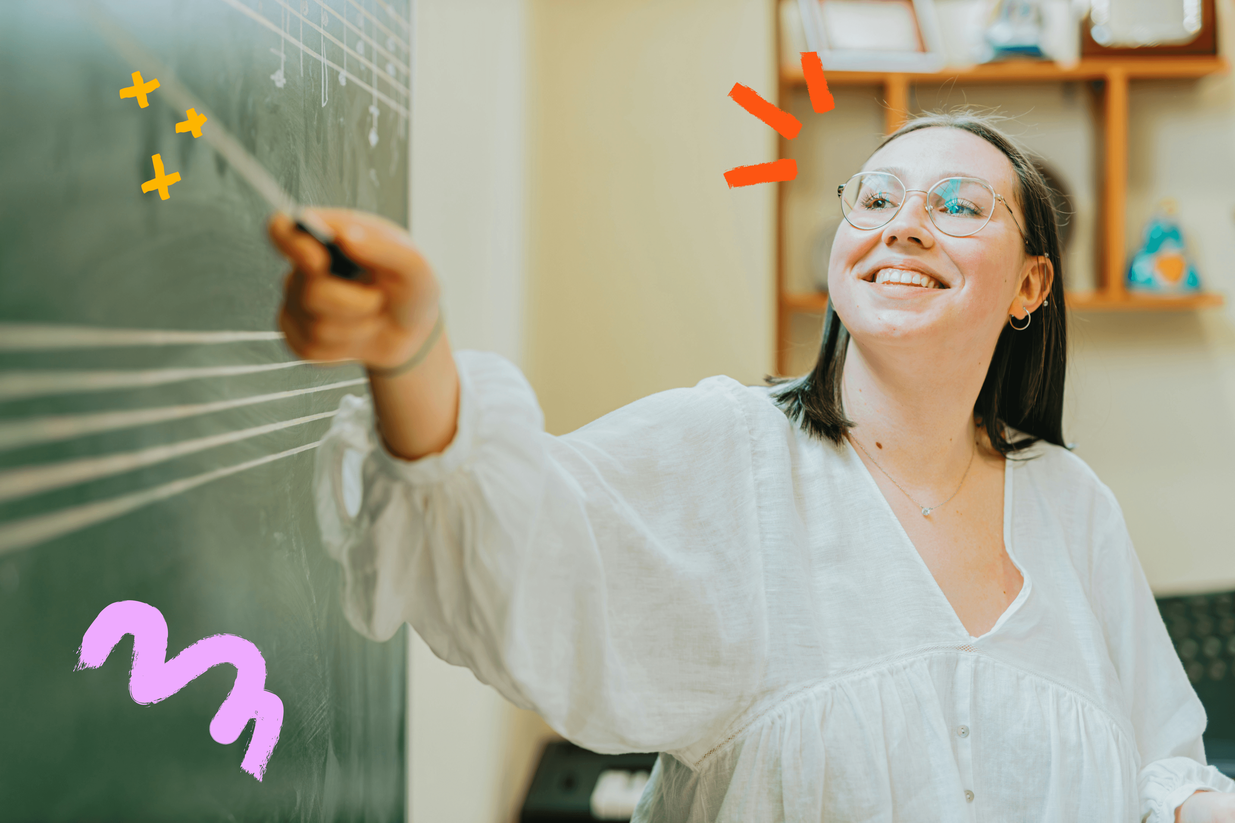 Image of teacher pointing to chalkboard