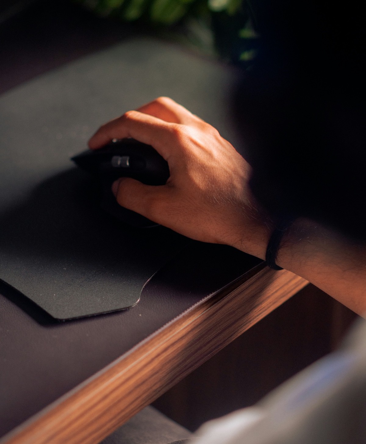 Close-up of a hand holding a pen over a surface - Boldway Studio capabilities