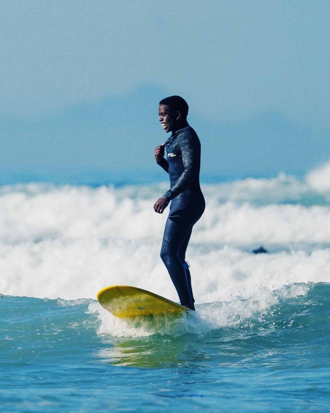 Surf Coach Mbuso Zozi surfing on a wave