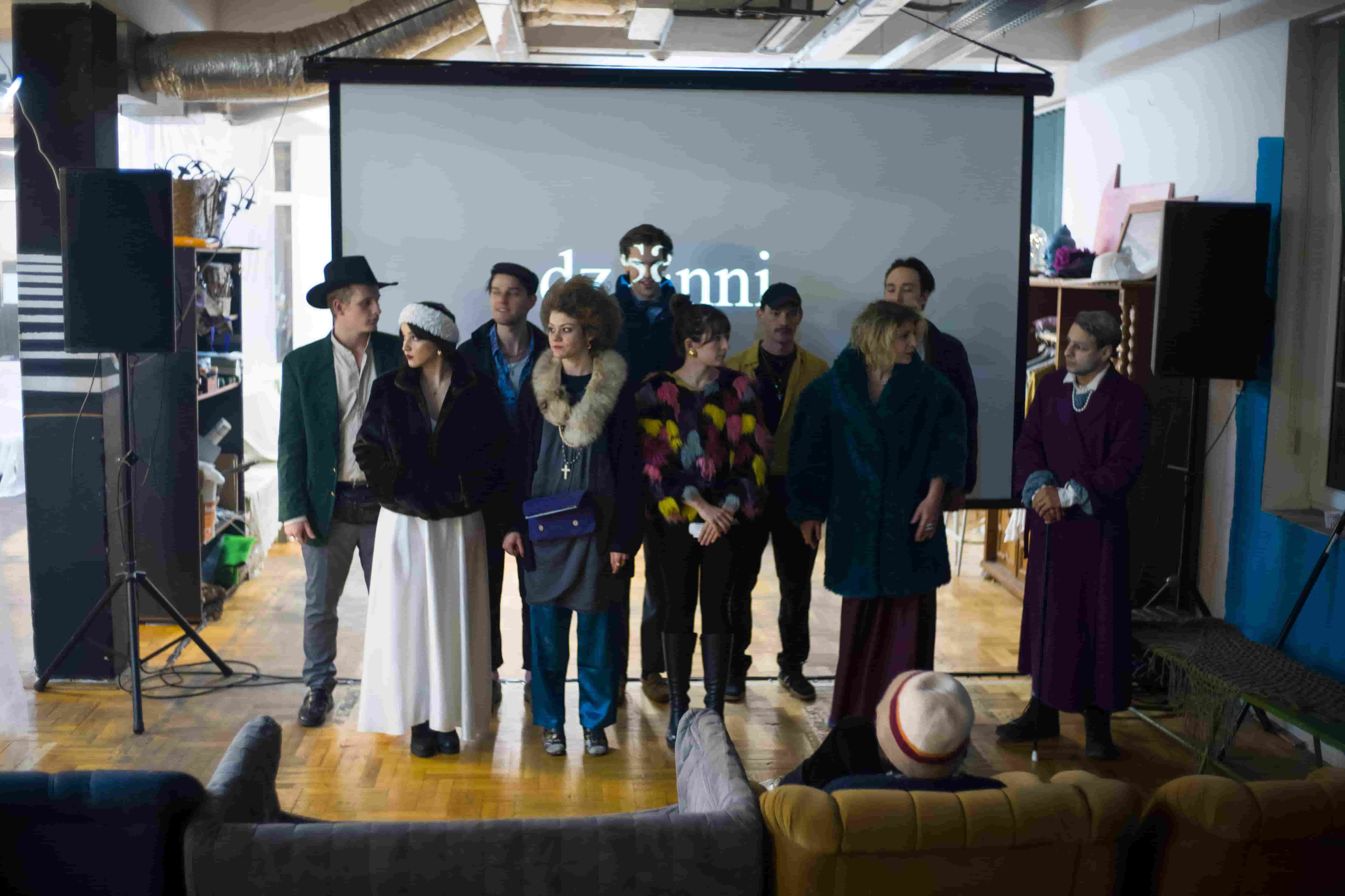 A person stands in a sandstone cave.