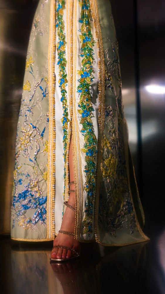 Beige and gold Moroccan caftan with blue embroidery, handcrafted couture piece designed for luxury occasions in Bahrain