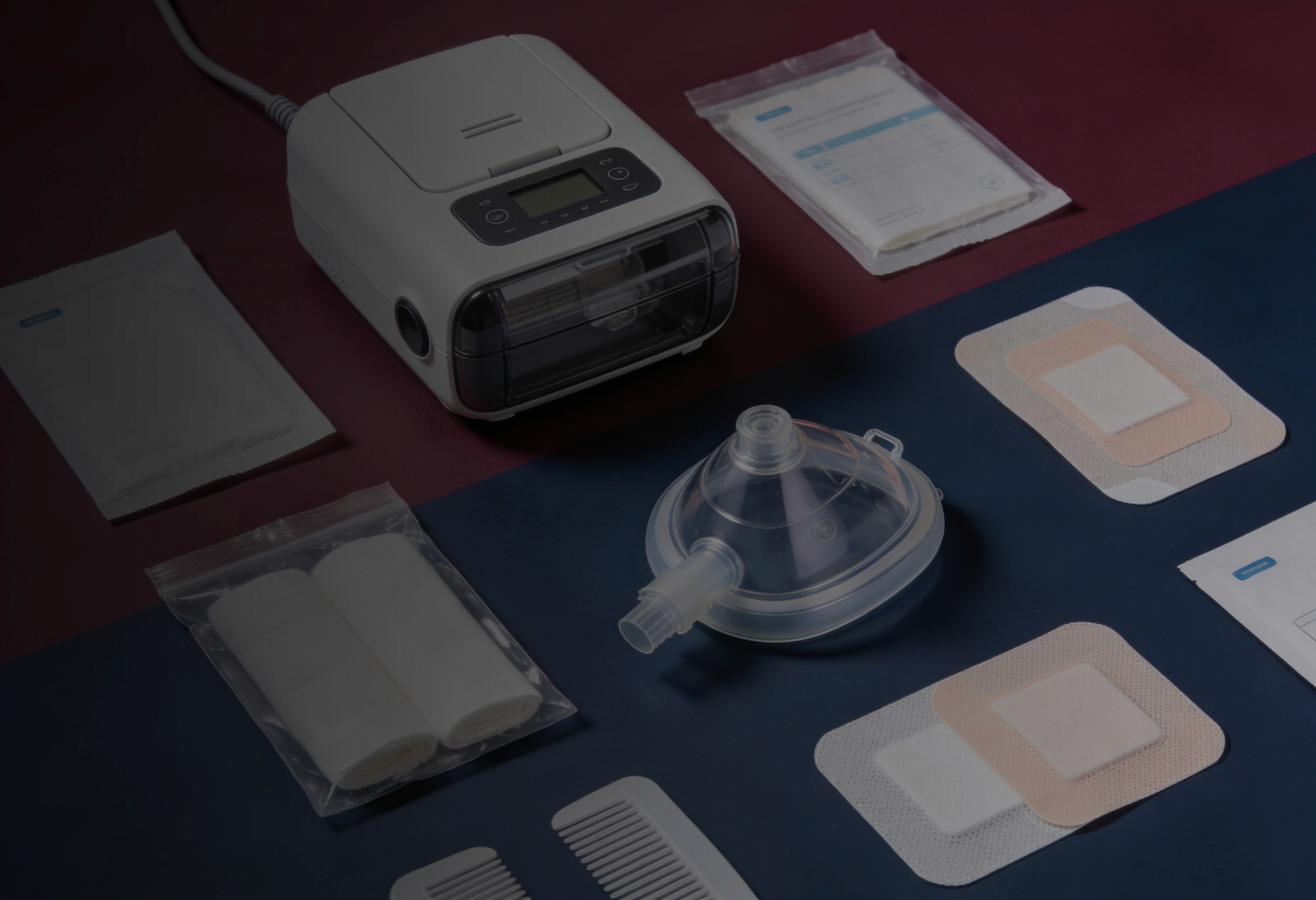Professional display of medical supplies including CPAP machine, wound dressings, CPAP mask, and bandages