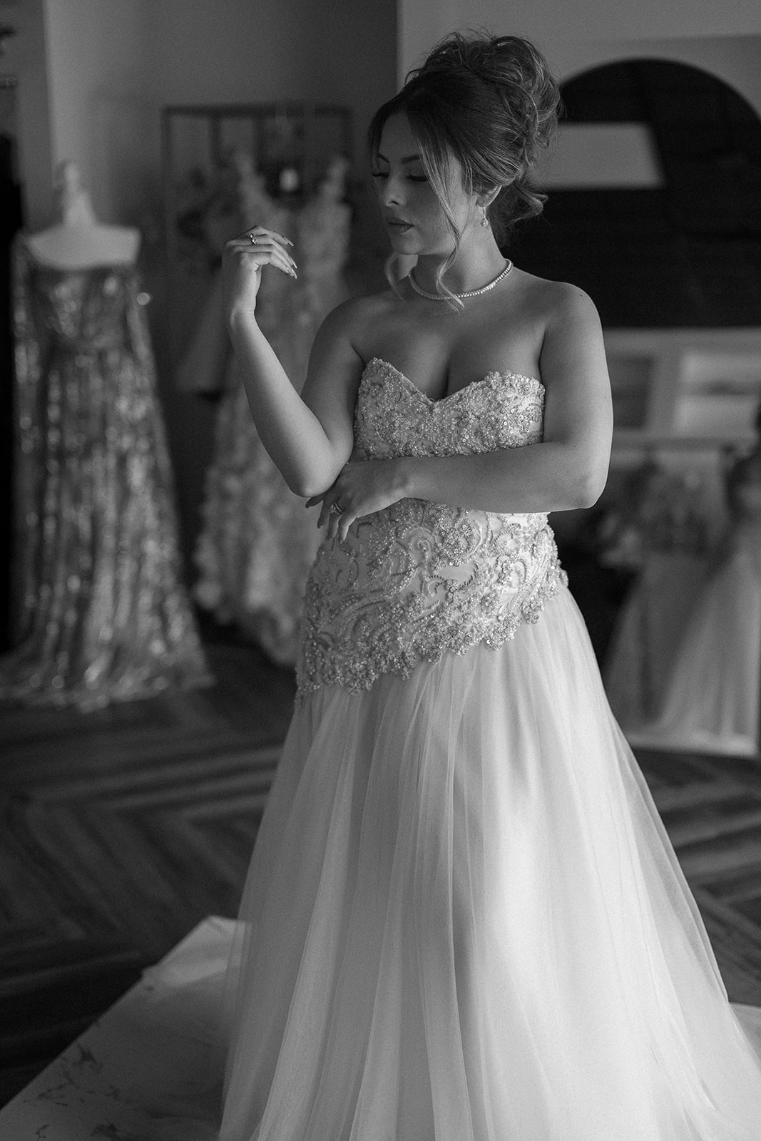 A couple stands closely in an intimate embrace.