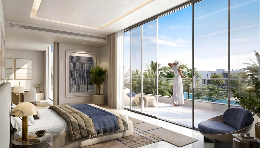 A modern bedroom featuring a large glass wall with a view of the pool at Address Villas Tierra.