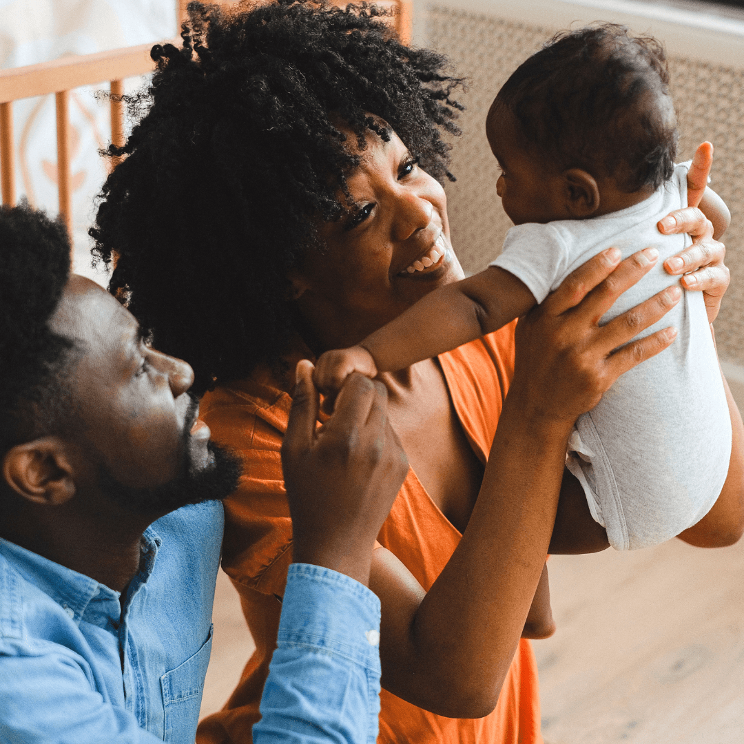 Photo with figurative purposes of a family formed by father, mother and daughter, where the father reads a story.