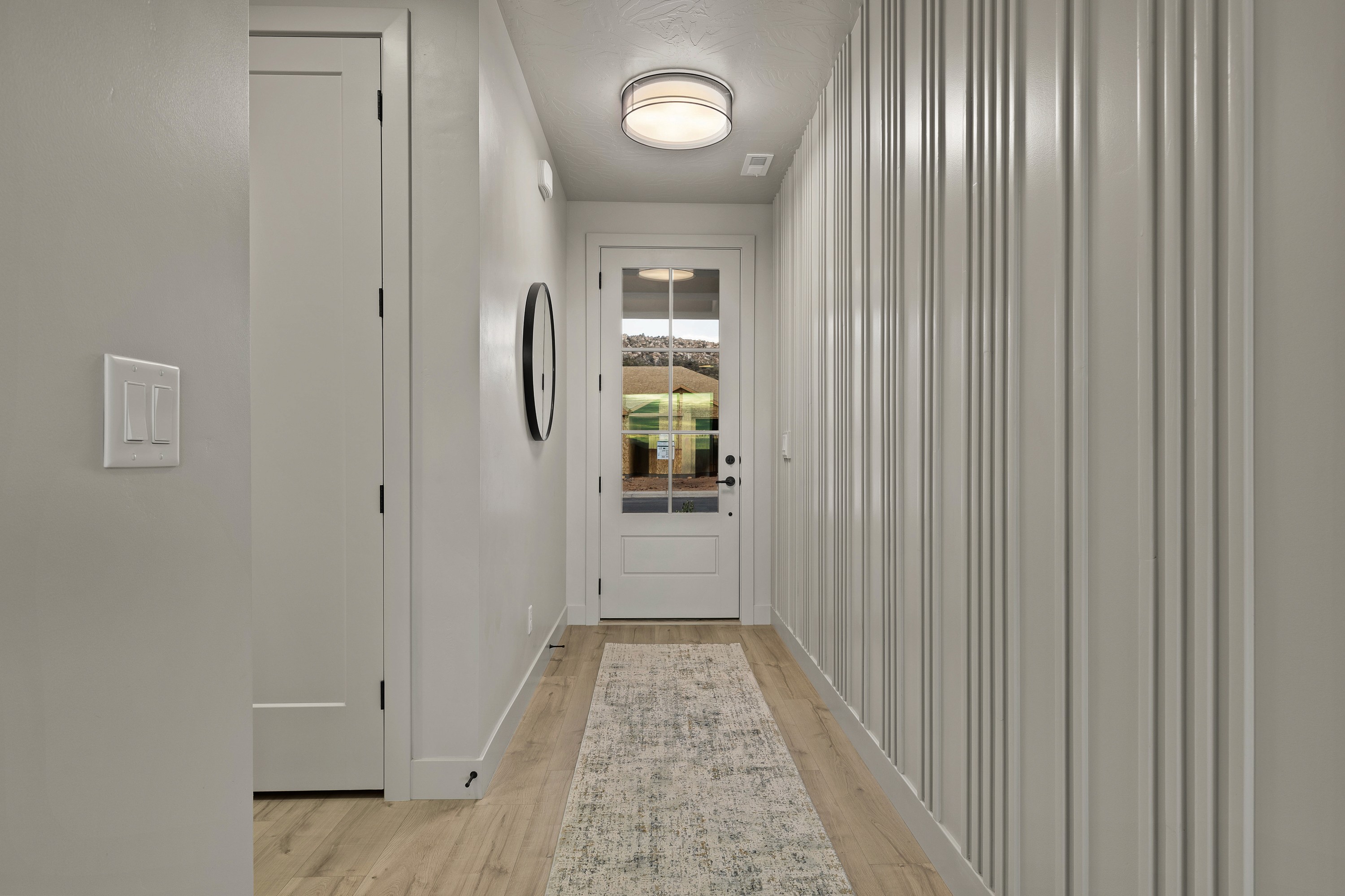 Entry accent wall in the BYSO House in Hurricane, Utah with thoughtful design details for a welcoming first impression.