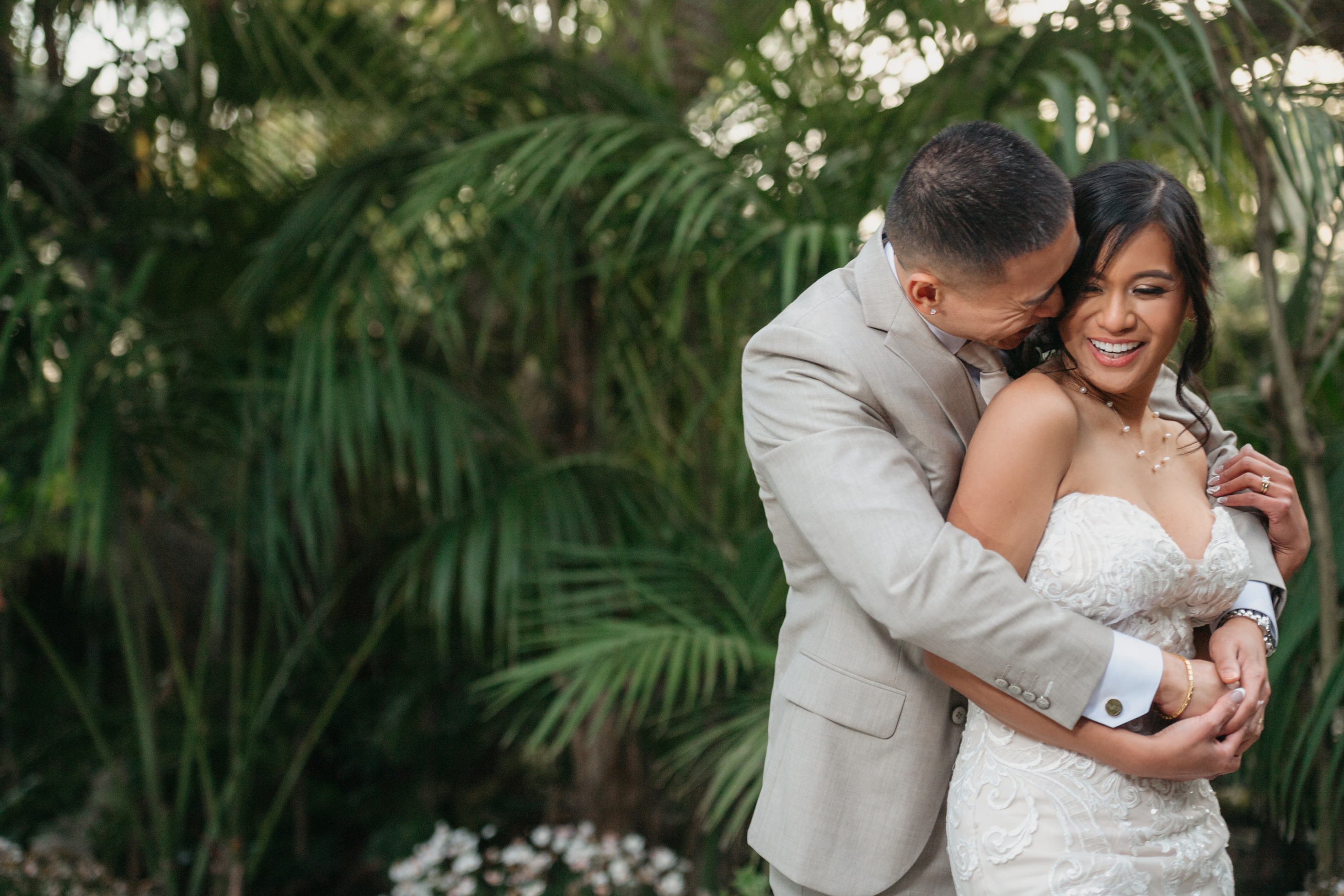 Flat lay wedding details with bouquet, rings, and sparkling bridal heels