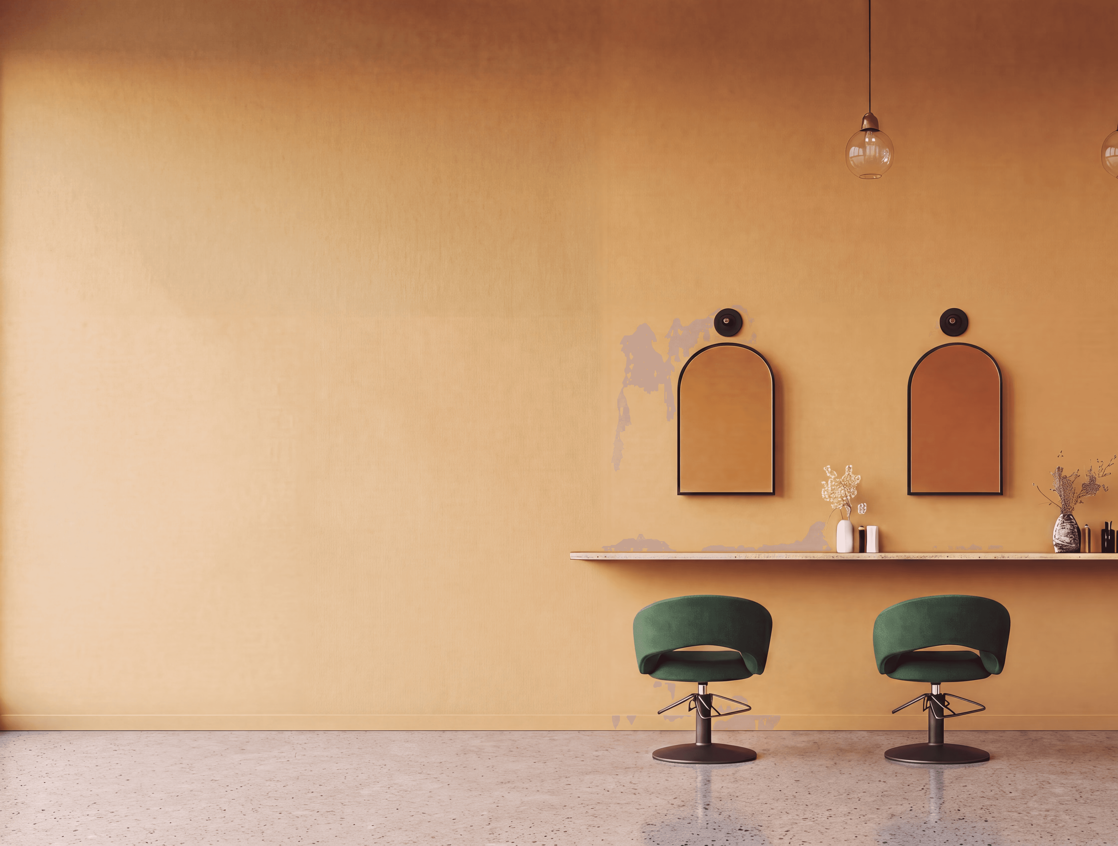 Interior of a modern hair salon with green velvet styling chairs, arched gold mirrors, warm pendant lighting, and wooden shelving with white product bottles