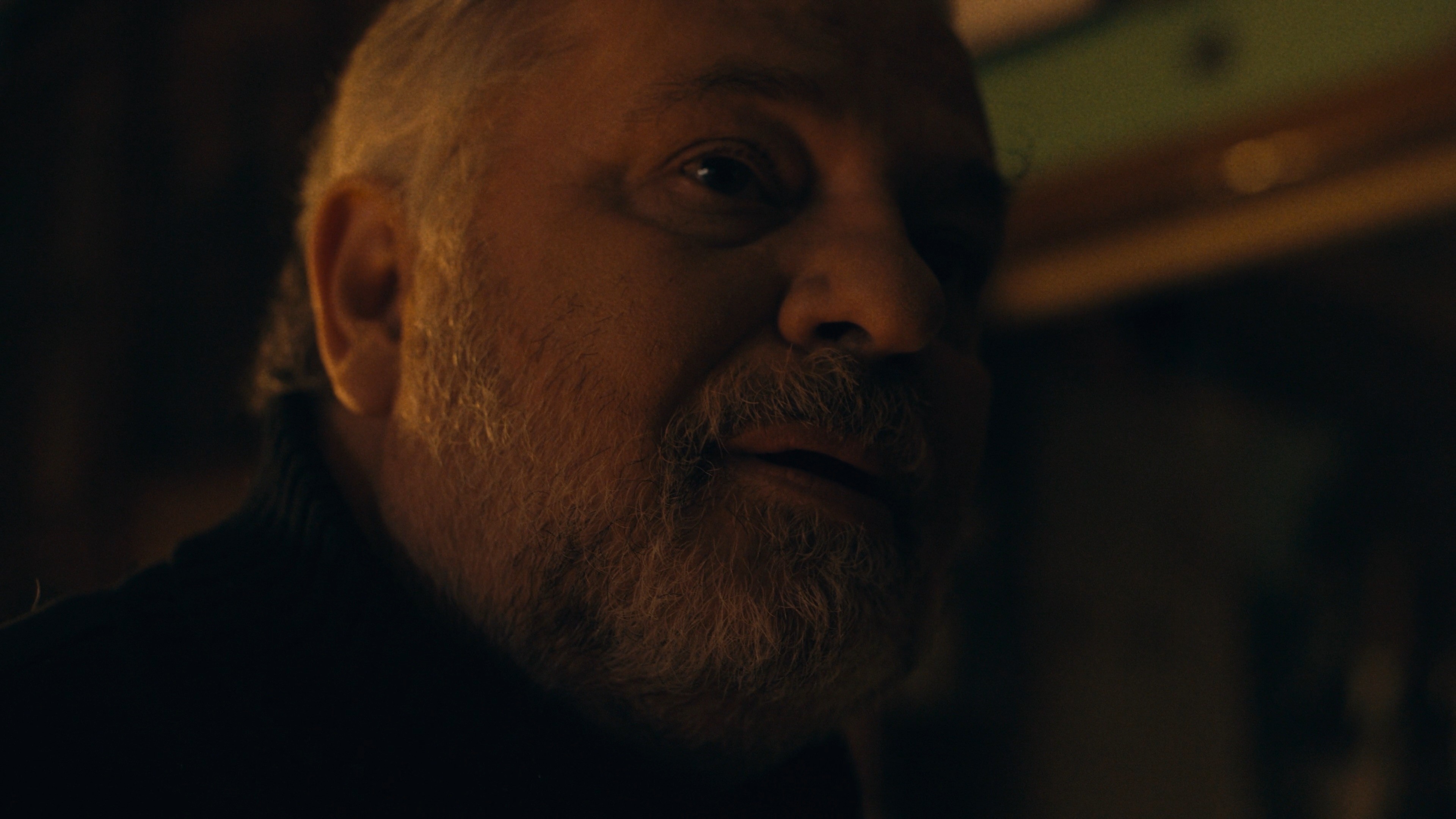 Profile shot of a main character in a dramatic lighting setup.