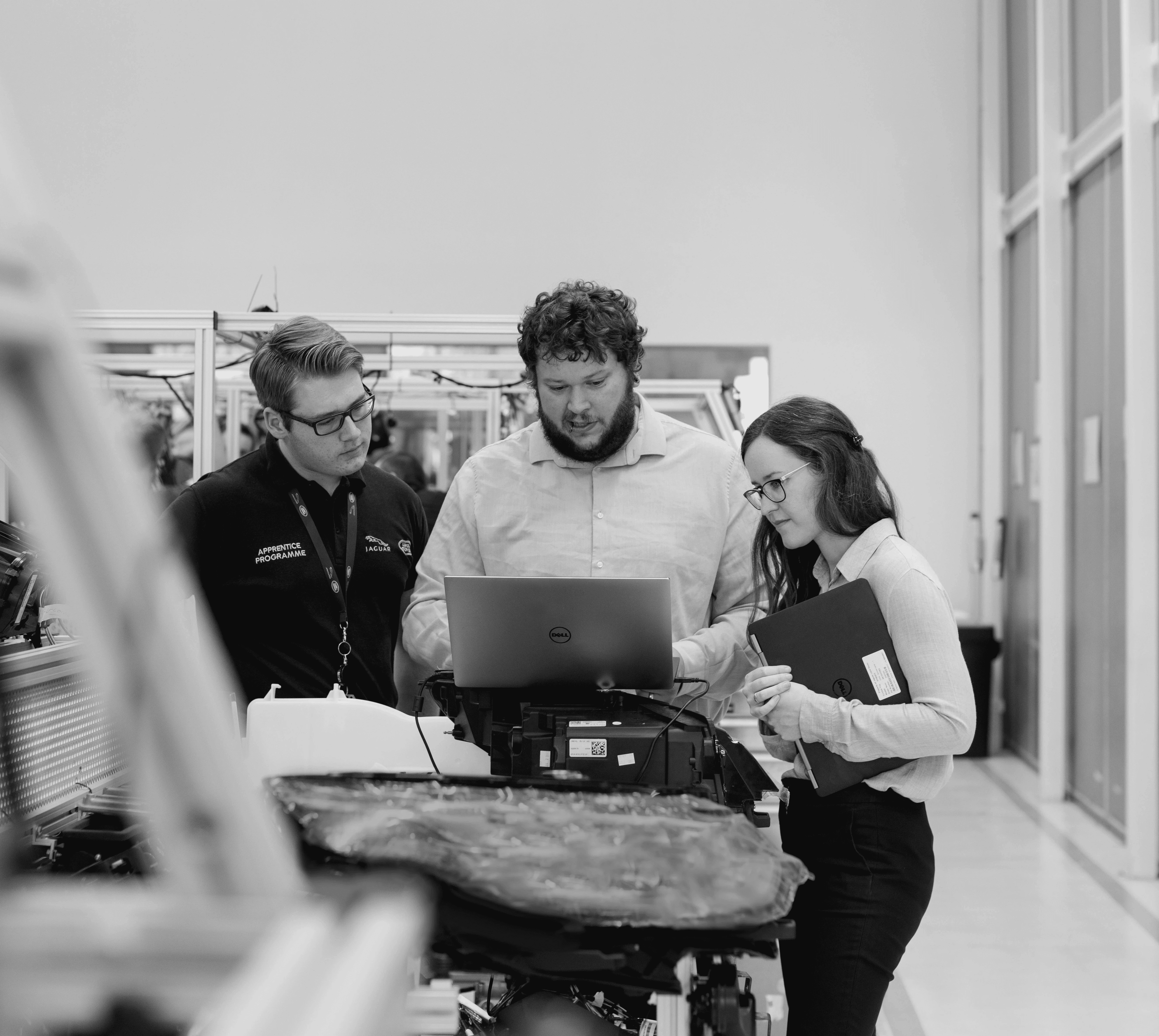 group of people sitting on chair in front of table with laptop computers