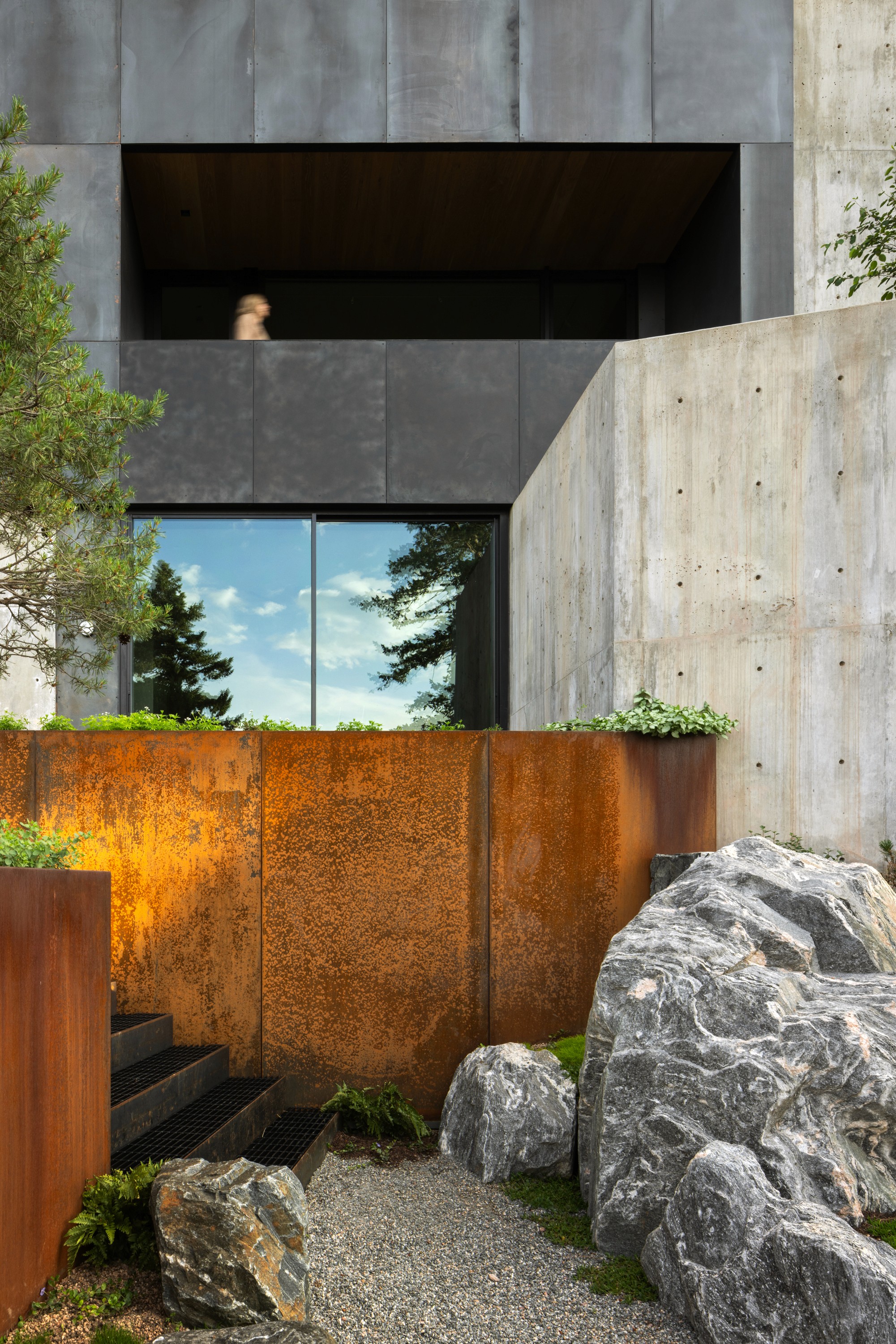 A graphic charcoal sketch of a basic floor plan layout on a site