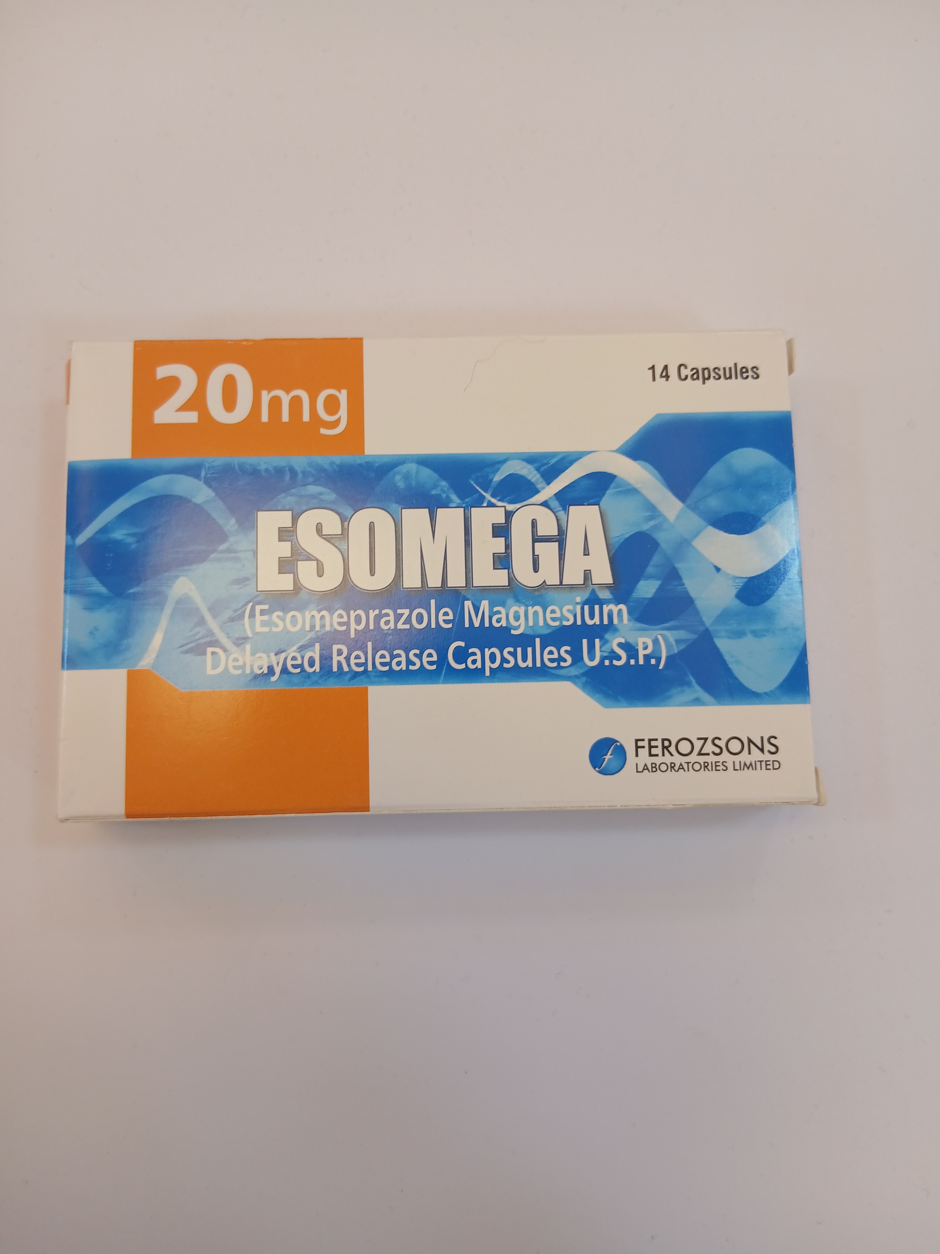 White cardboard packaging displays a blue and orange label with the text "20mg" and "14 Capsules," featuring an illustration of capsules and waves, produced by Ferrozsons Laboratories Limited.