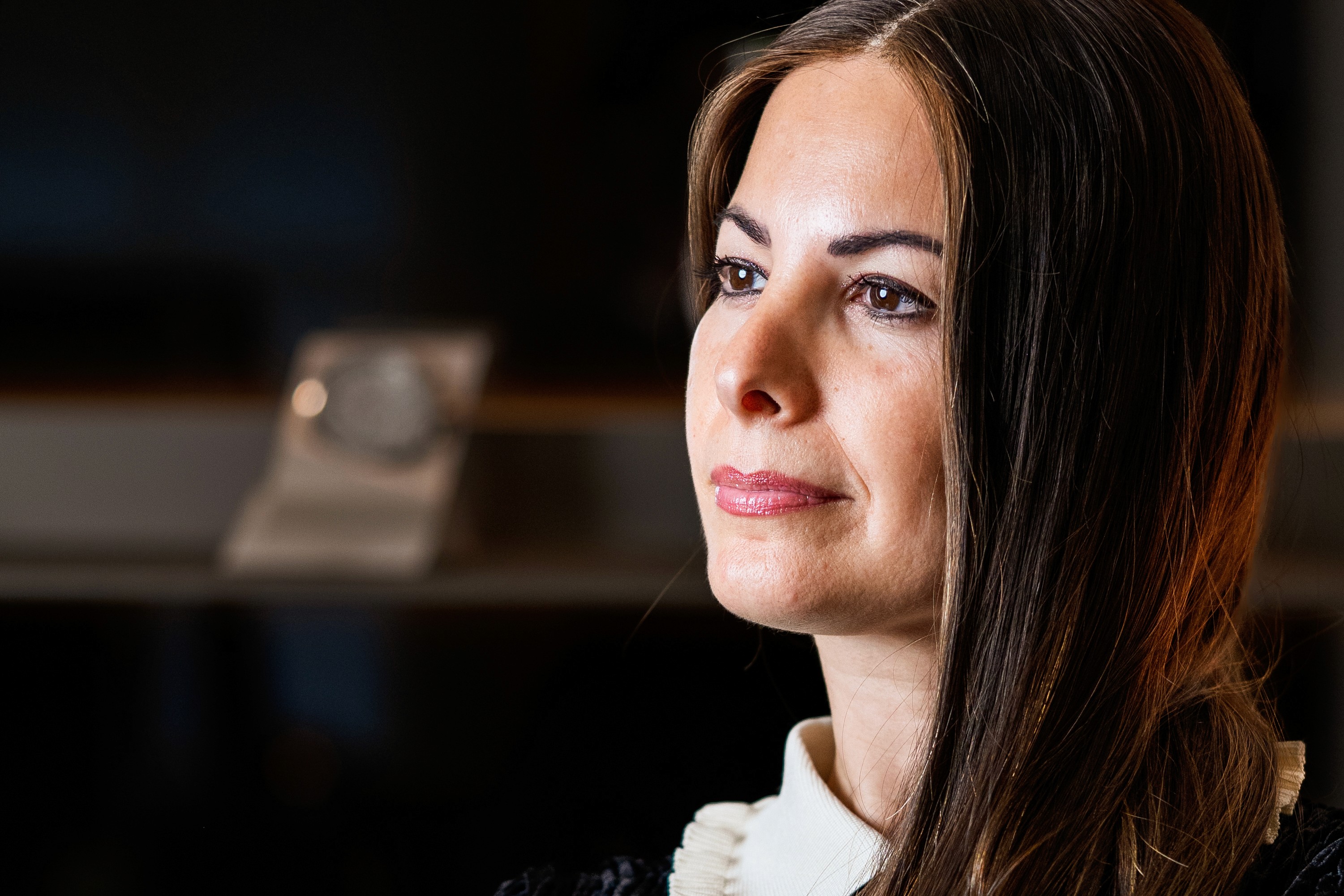 person holding black ipad with green plant
