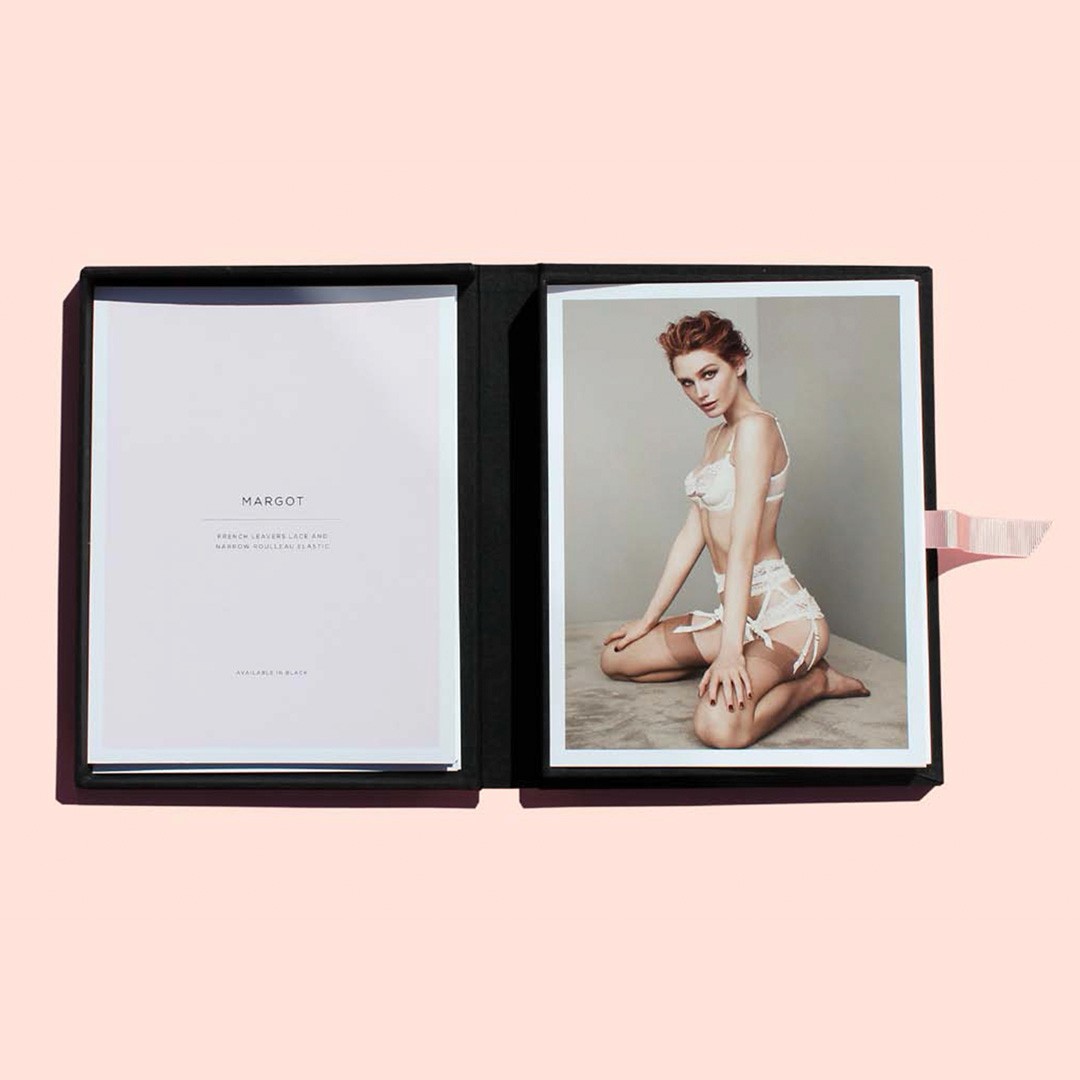 Black clam-shell box with product cards for Agent Provocateur 