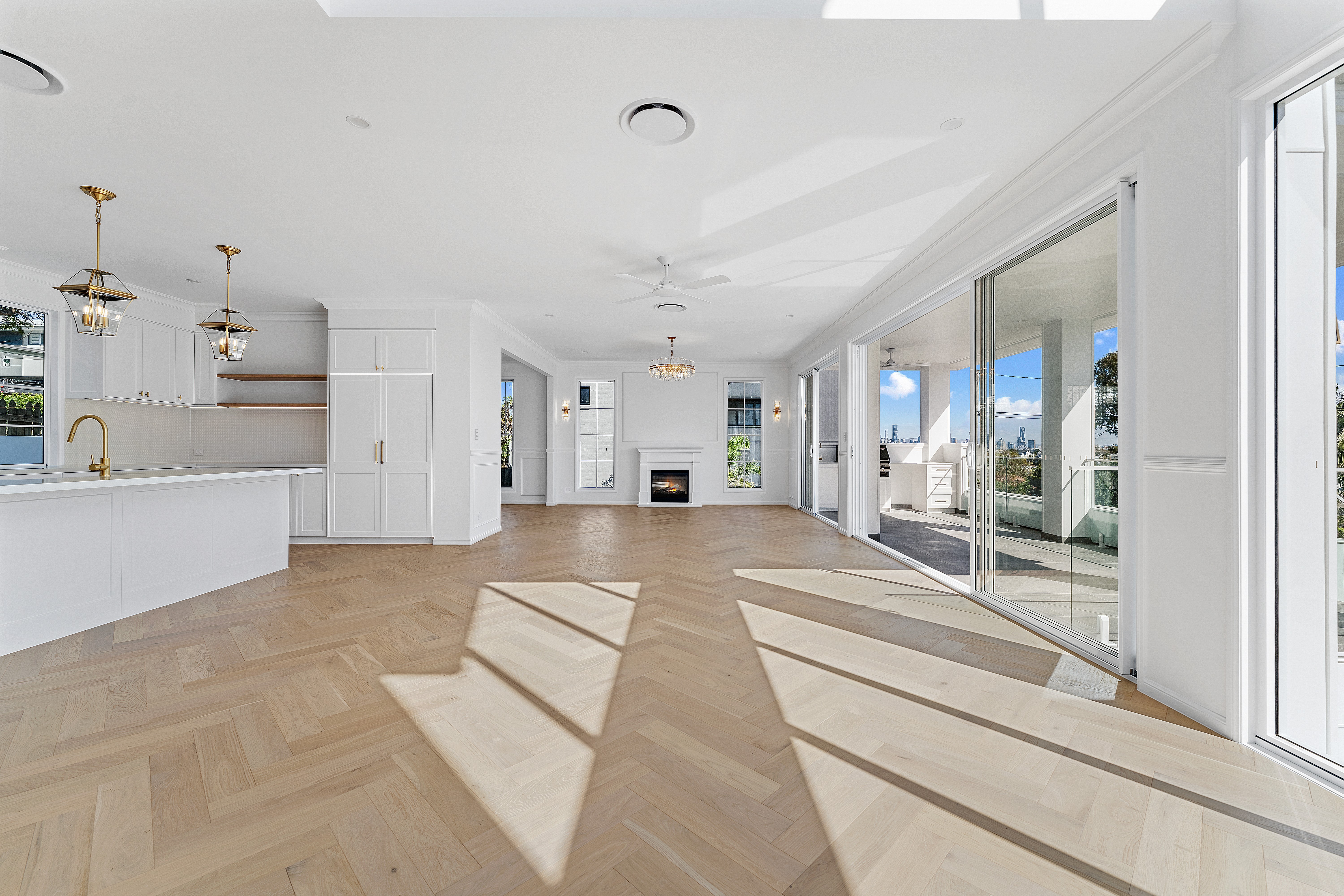 A custom home in Brisbane demonstrating ideal house orientation, natural light, and shaded outdoor living areas.