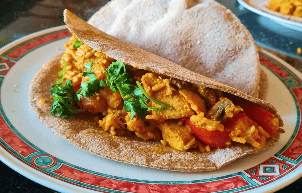 Vibrant vegan tacos topped with coriander on a plate