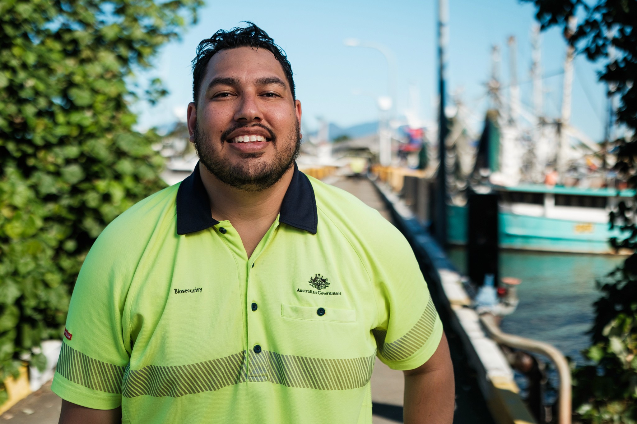 A man smiles in front of  a dock