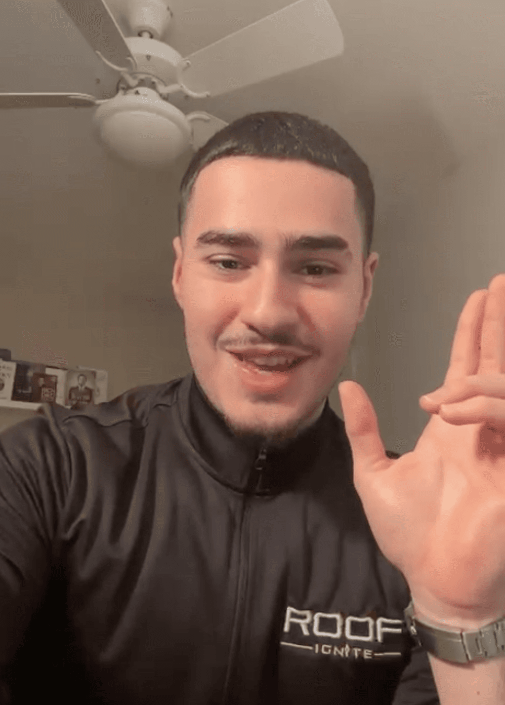 A man works on a laptop in an office.