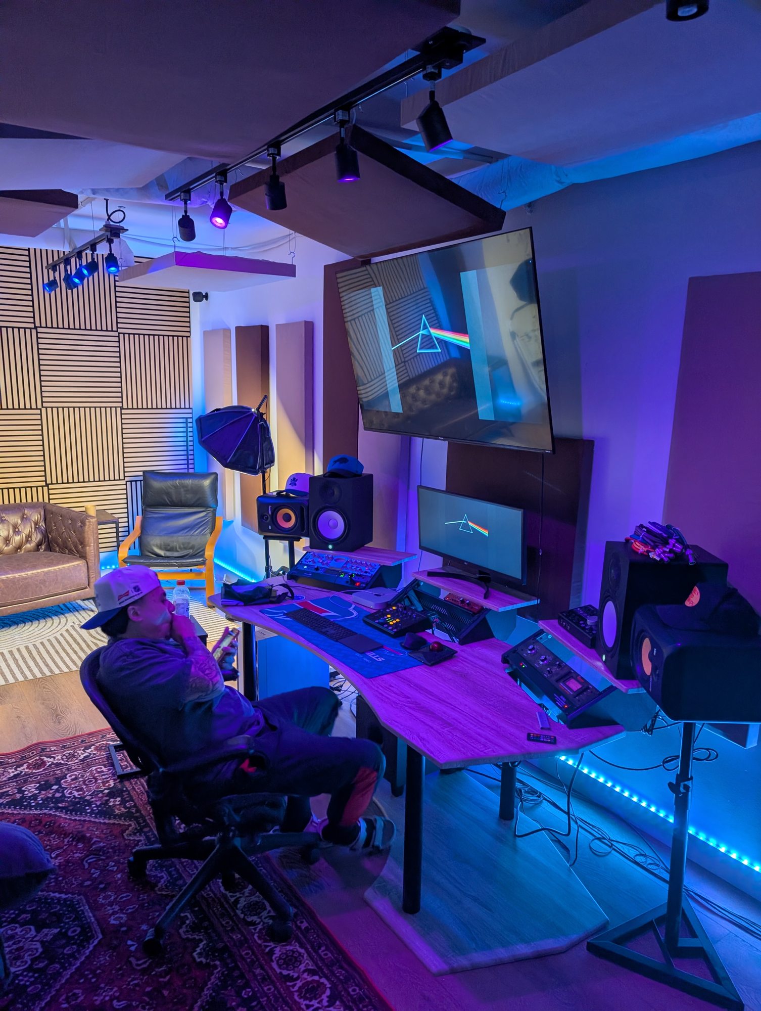 Professional music producer creating beats at the mixing desk inside Red Mile Records recording studio in Calgary.