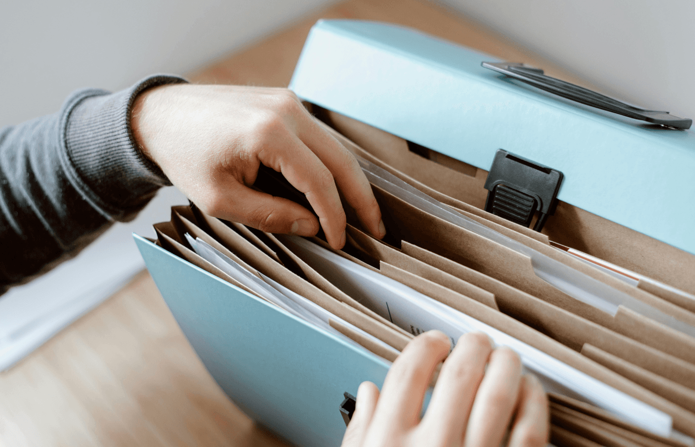 Person choosing document in folder