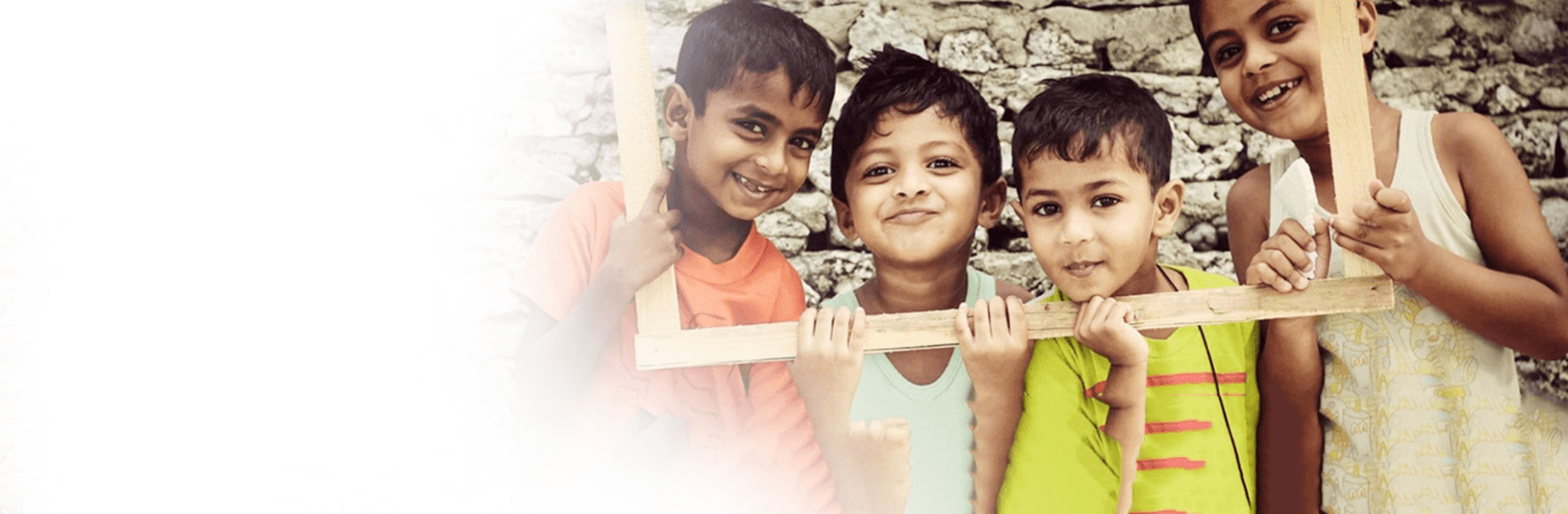person sitting on grass and using phone