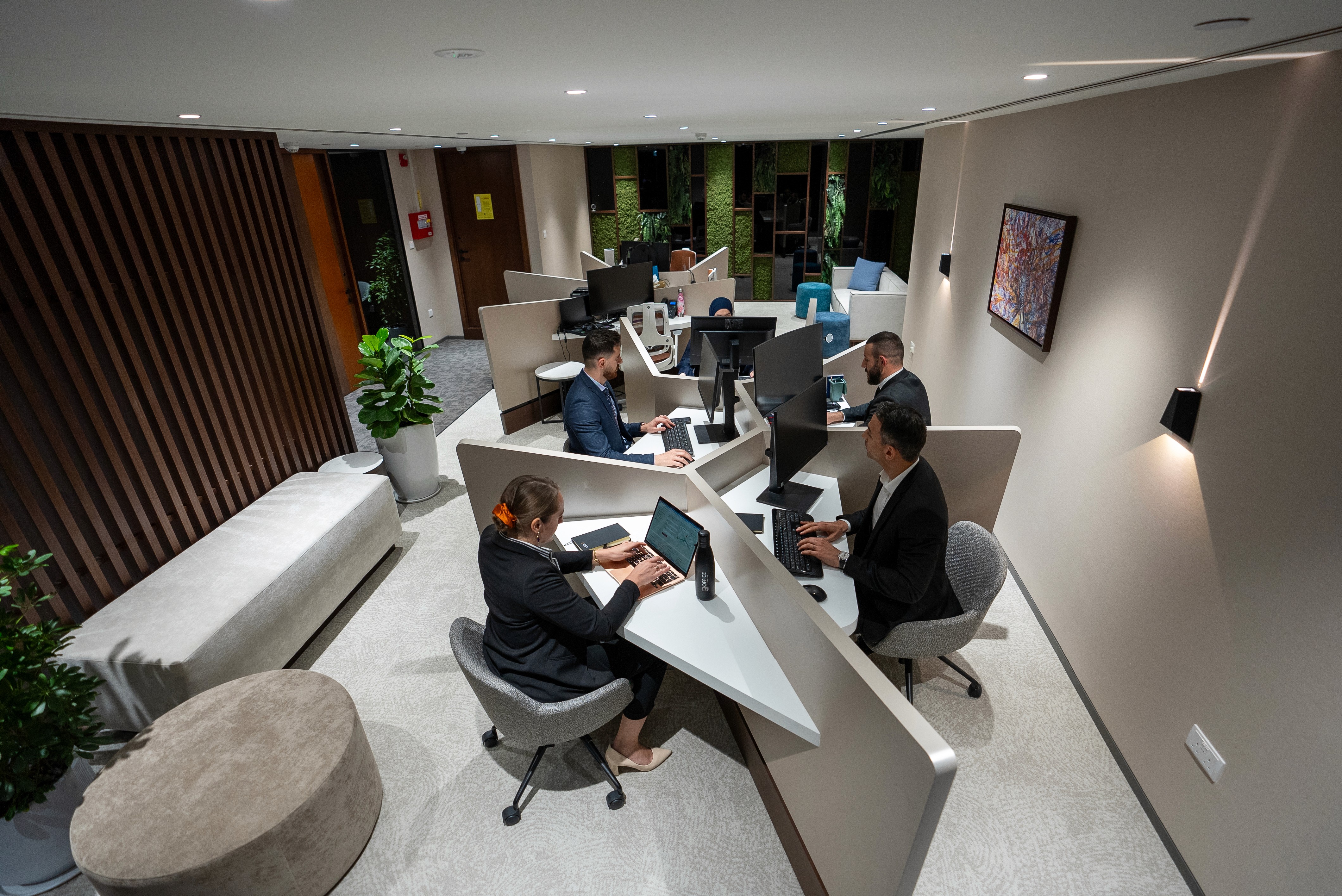 Professionals working in a collaborative serviced office in Abu Dhabi, managed by Office Square.