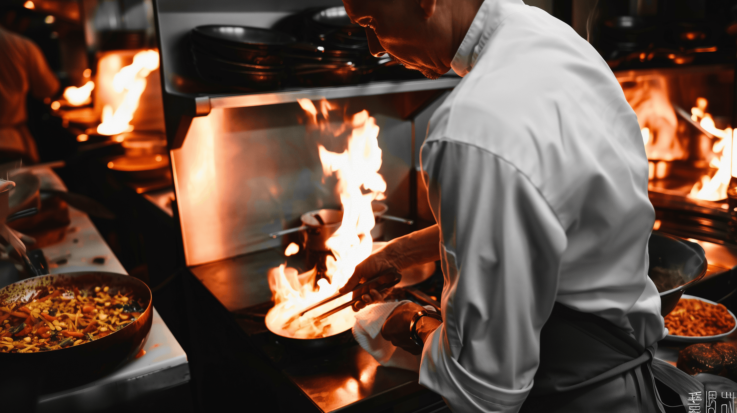 Chef preparing handcrafted pasta at PASTA 9 Toronto, showcasing open-kitchen cooking and the artistry behind every sauce.