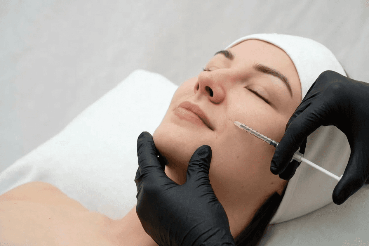 Woman receiving profhilo treatment injection in clinic setting