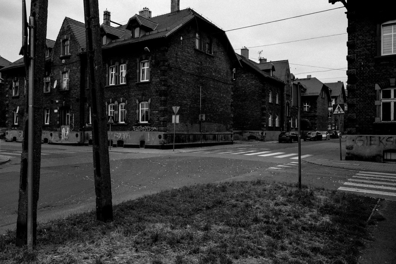 Perspective view of a road in Silesia, monochrome documentary style.