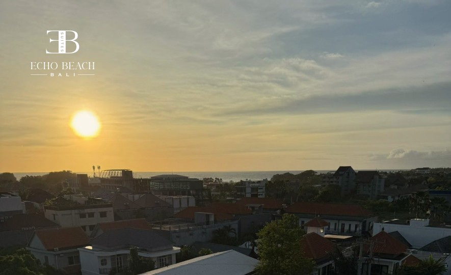 Penthouse Living Room, Echo Beach Suite: View of the spacious lounge area with a large sofa and 65-inch Smart TV. Luxury entertainment in Canggu, Bali.