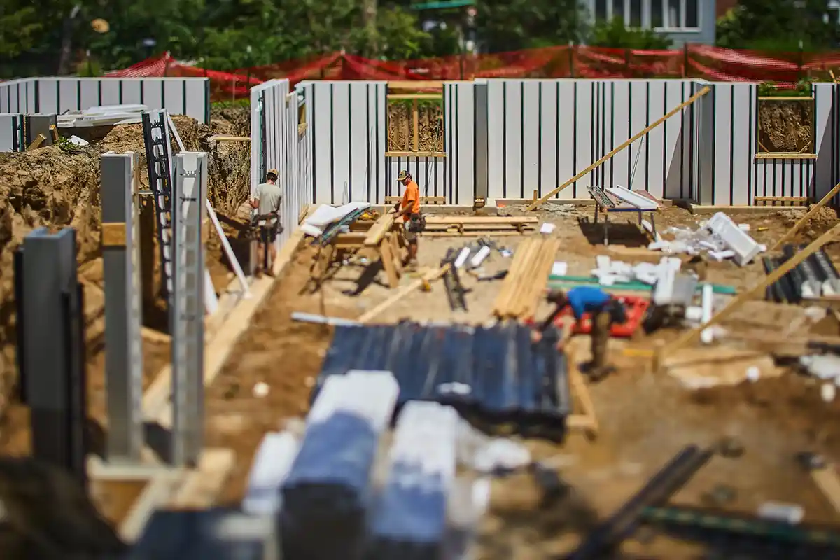 A crew building a wall section with Pow-R-Wall
