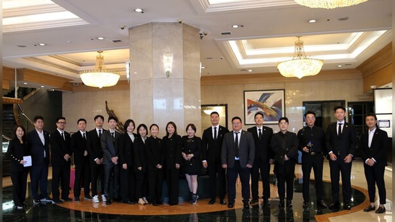 KACCUSA next-generation leaders delegation in black suits in a Seoul hotel lobby, 2026