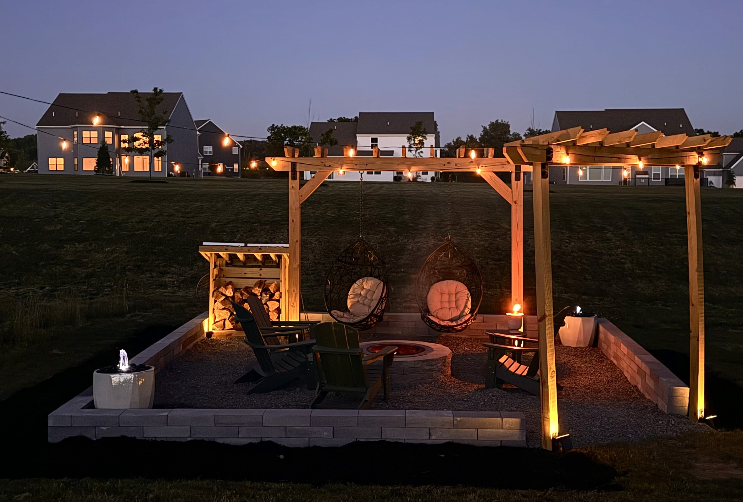 Custom backyard fire pit gathering area