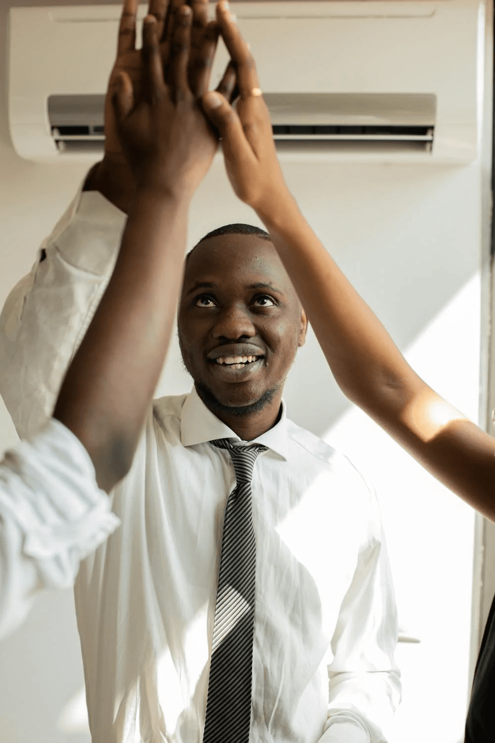 Happy people giving high fives