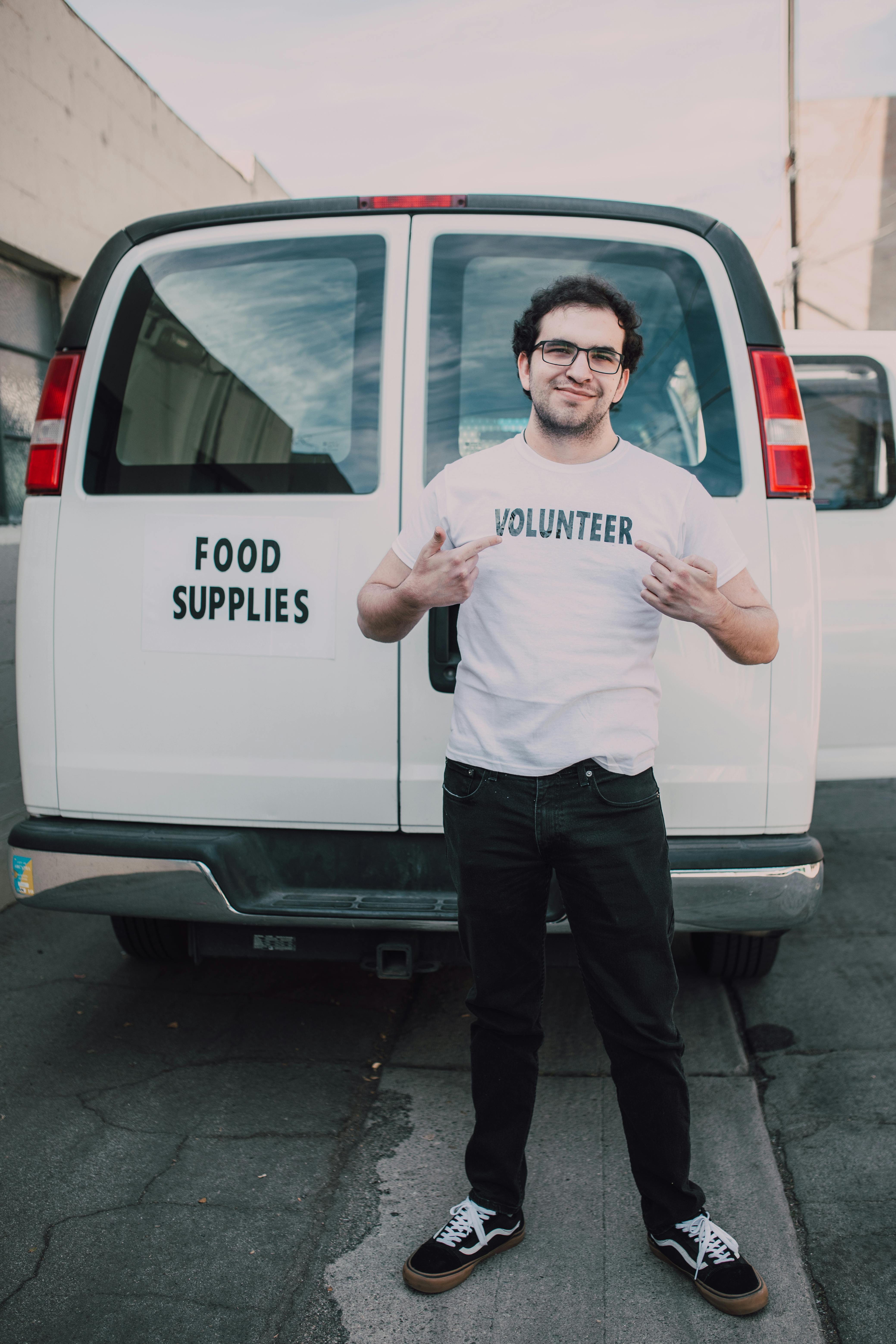 Volunteers in fron of a van